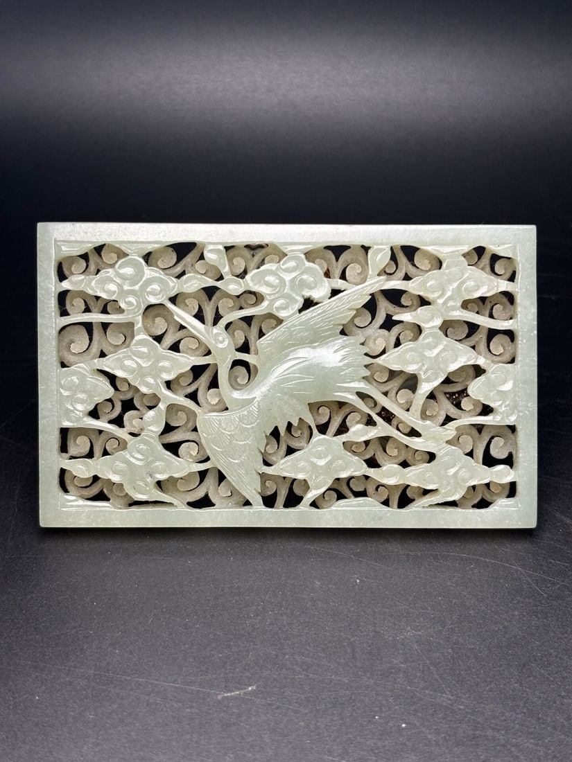 An Exquisite White Jade Hollow Auspicious Cloud and Crane Pattern Pendant: An Exquisite White Jade Hollow Auspicious Cloud and Crane Pattern Pendant,Qing Dynasty,China,Size:96mmx59mmx8mm,Weight:77g 白玉镂空祥云鹤纹挂Ê