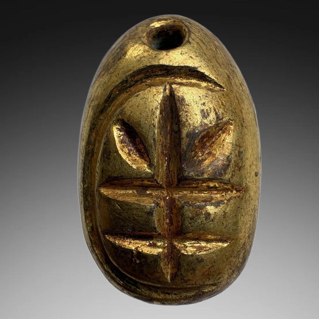 A Exquisite Gilt Bronze Coin: A Exquisite Gilt Bronze Coin,Han Dynasty, China,Size:0.8inx1.2in,Weight:23.6g 铜鎏金鬼脸金钱,中国汉代
