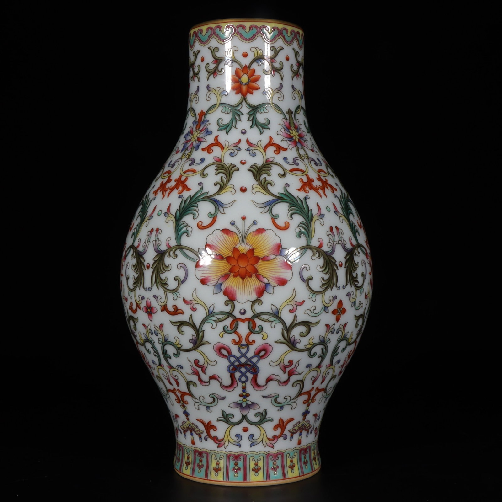 A Exquisite Famille-Rose White Ground Lotus Pattern Vase: A Exquisite Famille-Rose White Ground Lotus Pattern Vase,Qing Dynasty, China,Qianlong Six-character Mark,Size:10.6inx2.8inx3.5in