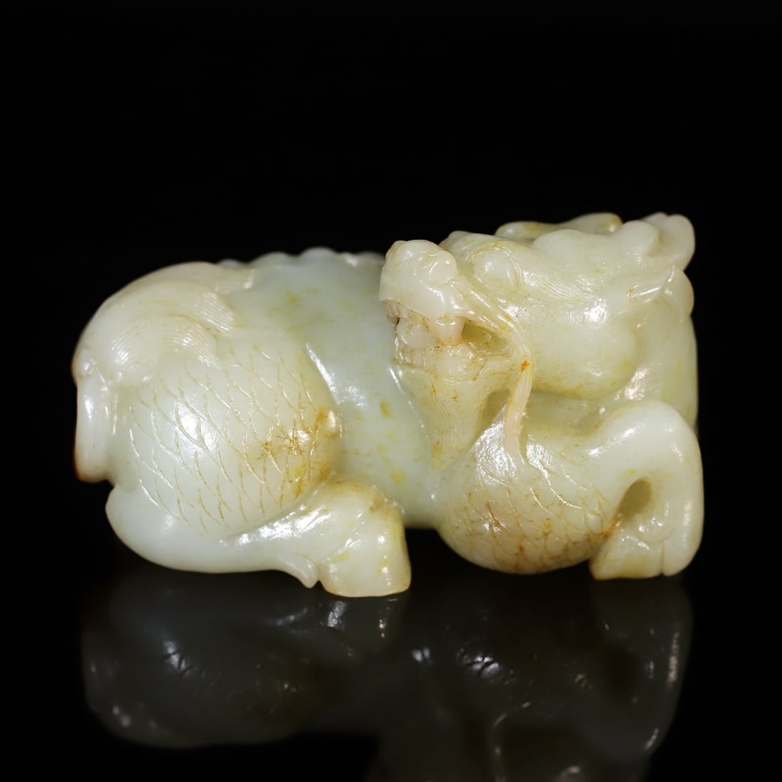 A Exquisite Hotan Jade Kylin Ornament: An Exquisite Hotan Jade Kylin Ornament,Qing Dynasty, China,Size:3.9inx2inx2in,Weight:375g 和田玉麒麟摆件,中国清代