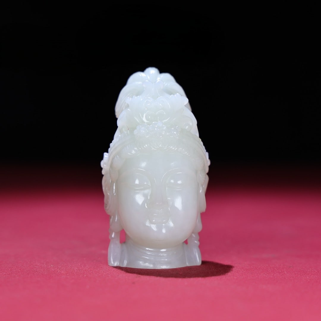 A Exquisite Hotan White Jade Avalokitesvara Head: An Exquisite Hotan White Jade Avalokitesvara Head,Qing Dynasty, China,Size:1.7inx3.2inx1.9in,Weight:182g 和田白玉观音首,中国清代
