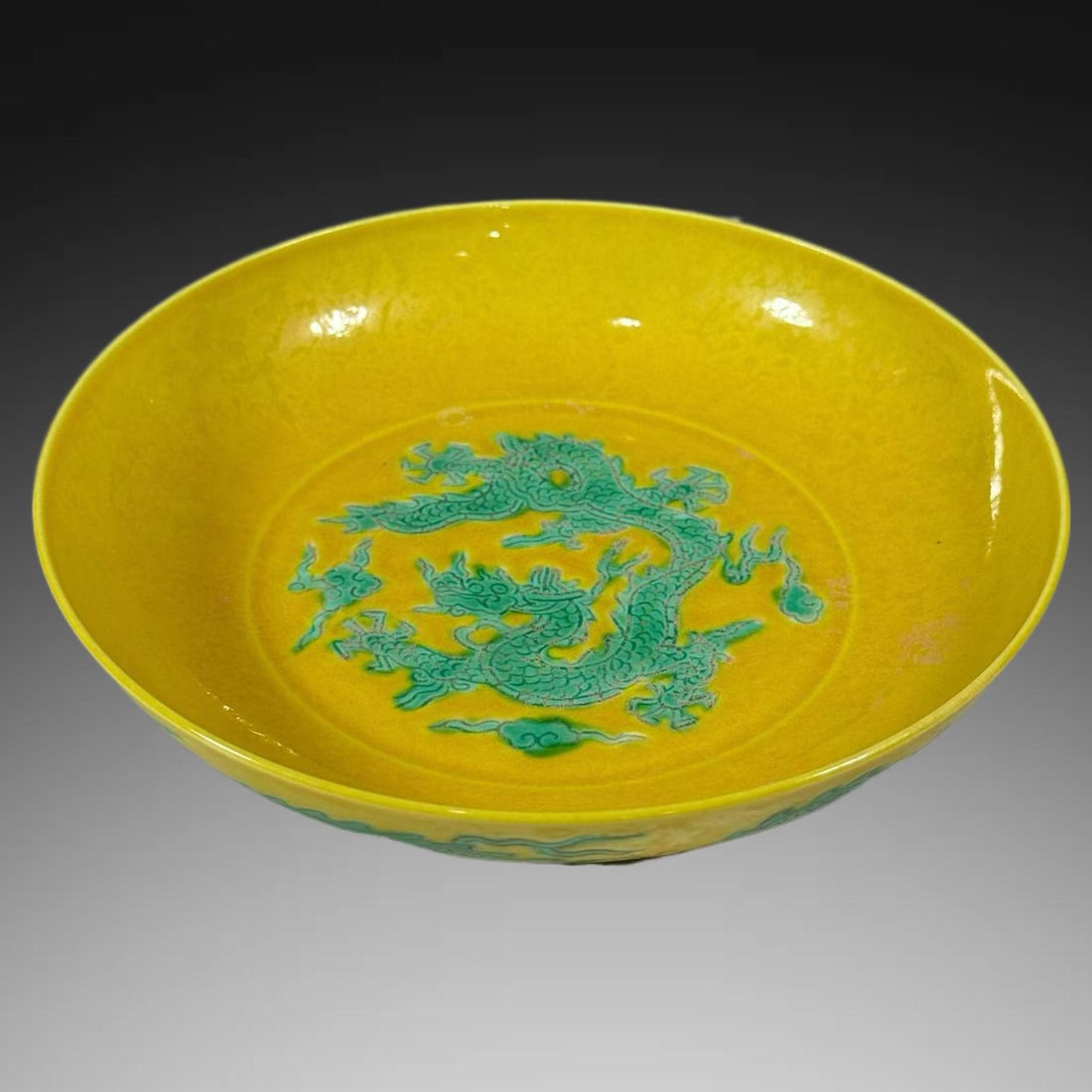 A Exquisite Yellow Ground Green Color Dragon Pattern Plate: A Exquisite Yellow Ground Green Color Dragon Pattern Plate,Ming Dynasty, China,Hongzhi Six-character Mark,Size:5.9inx1.4in 黄地绿彩龙纹盘,中国