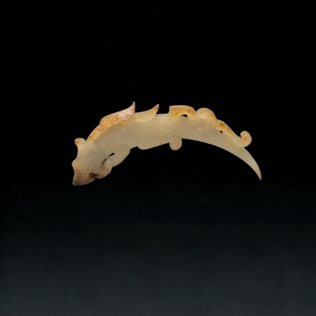 A Exquisite Hotan Jade Dragon Handheld Carving: An Exquisite Hotan Jade Dragon Handheld Carving,Han Dynasty, China,Size:0.8inx3.4inx0.2in,Weight:16.8g 和田玉龙手把件,中国汉代