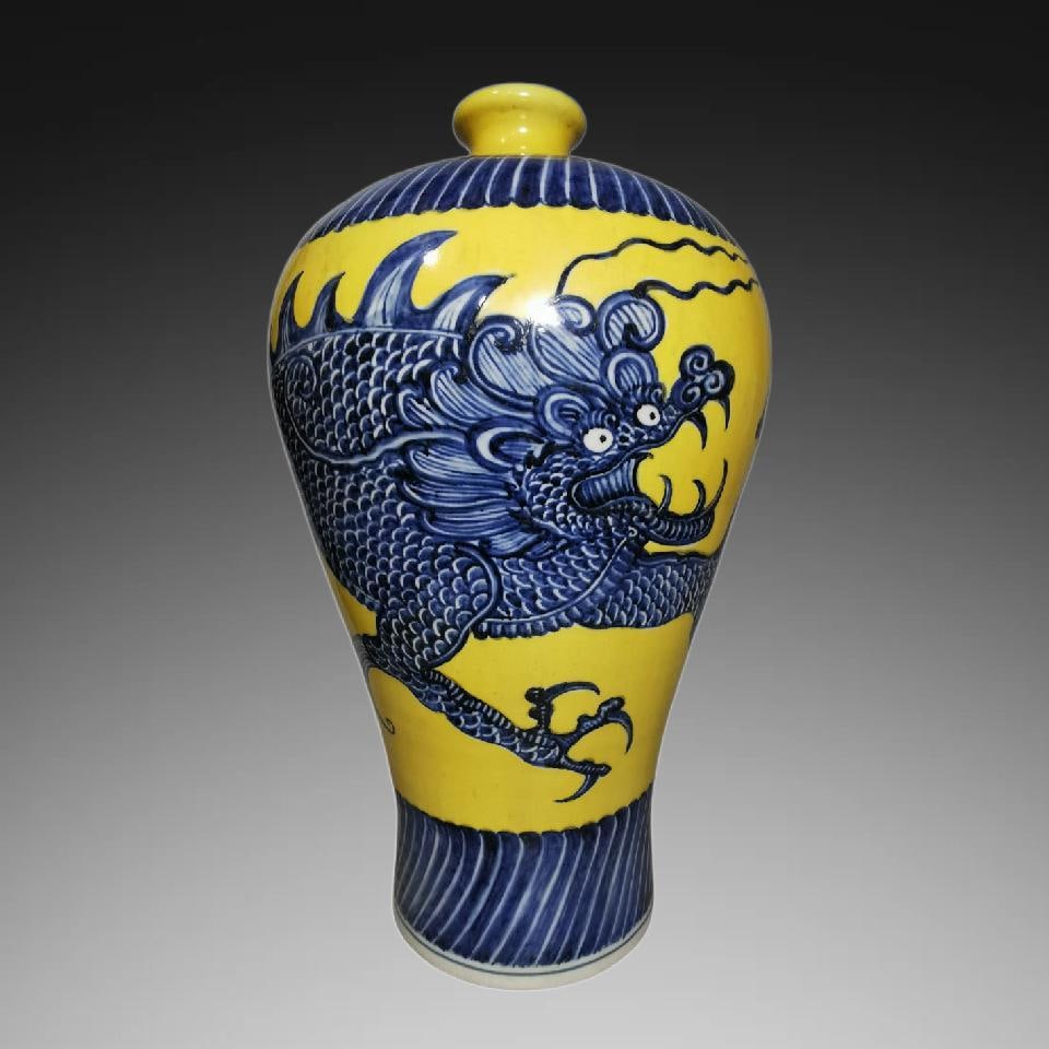 A Exquisite Yellow Ground Blue and White Dragon Pattern Vase: An Exquisite Yellow Ground Blue and White Dragon Pattern Vase,Ming Dynasty, China,Xuande Six-character Mark,Size:17.7inx10.2in 黄地青花龙纹瓶,中国