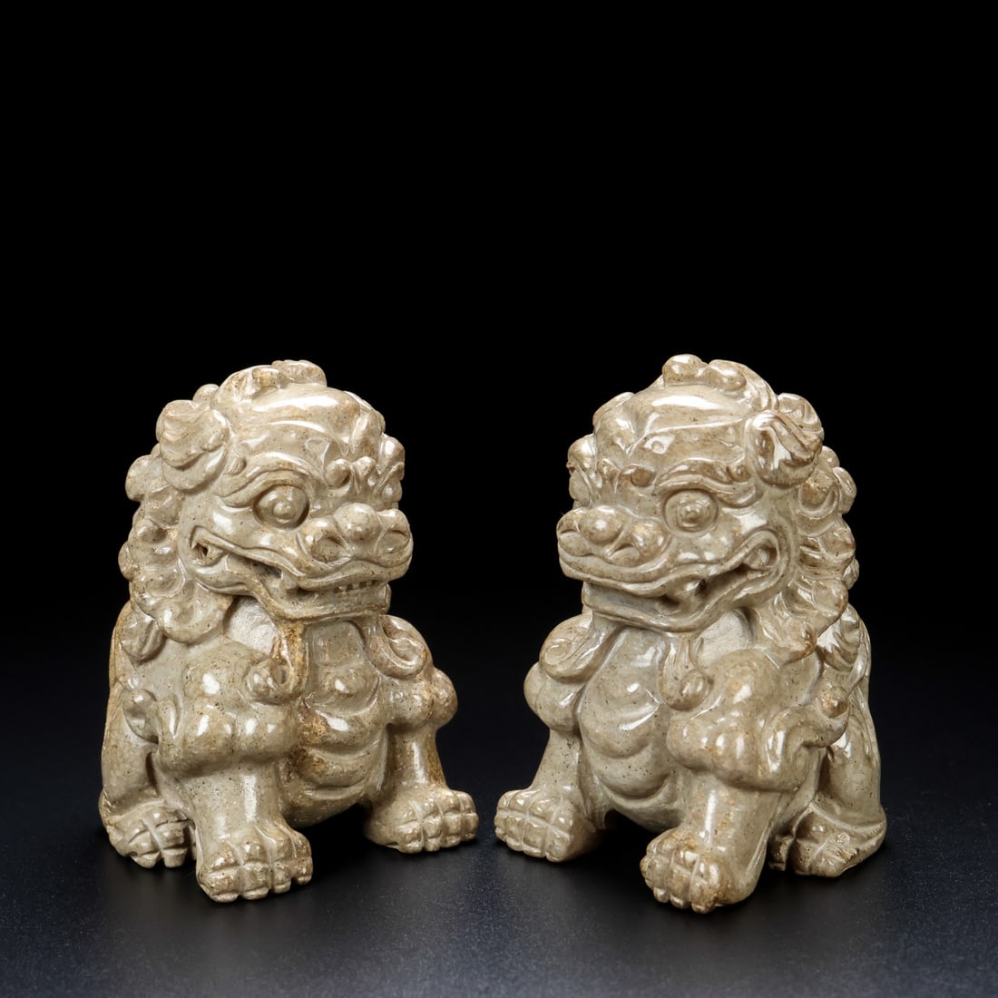 A pair of Exquisite Hotan Jade Lion Ornament: A pair of Exquisite Hotan Jade Lion Ornament,Qing Dynasty, China,Size:1.8inx1.6inx2.6in(Single) ,Weight:320g