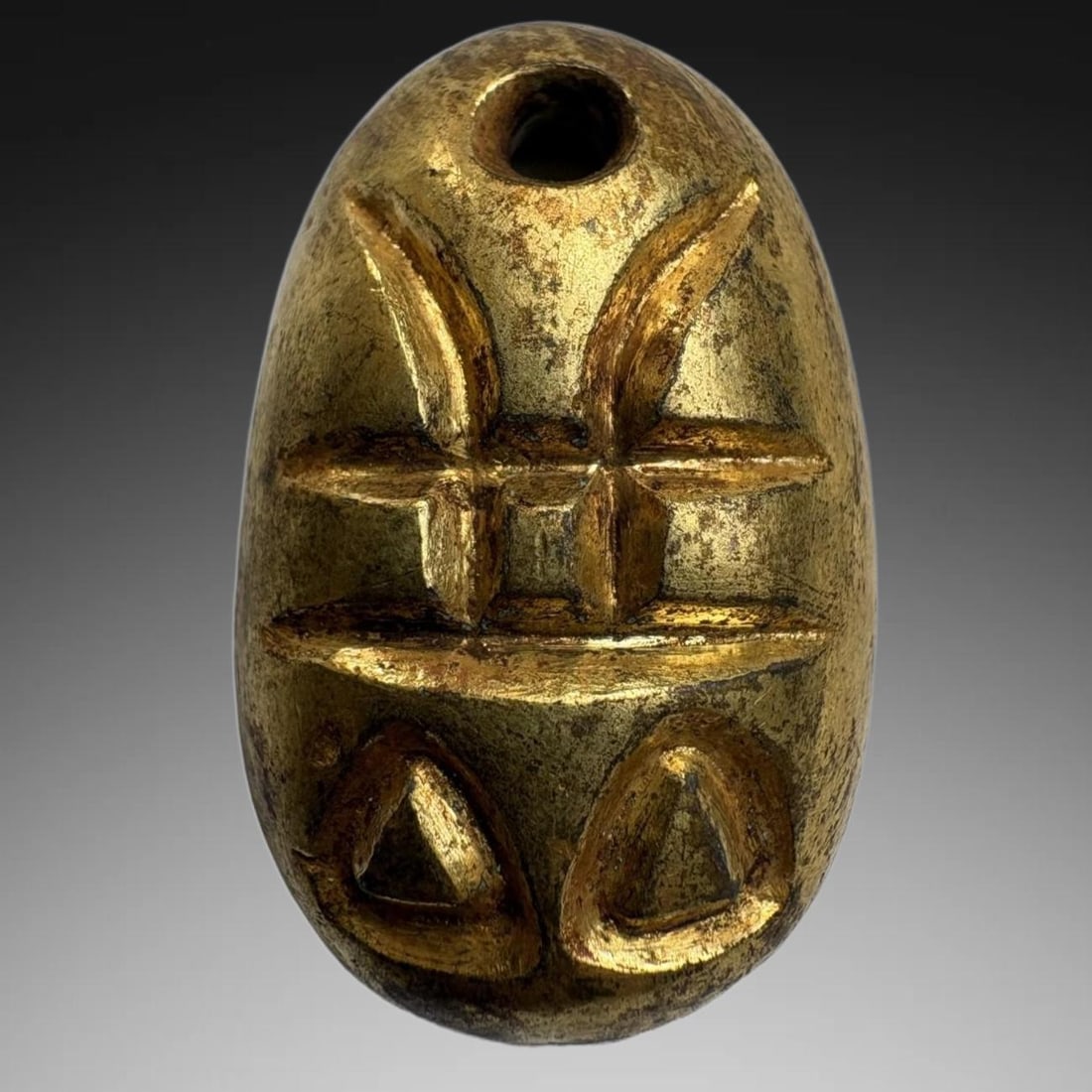 A Exquisite Gilt Bronze Coin: A Exquisite Gilt Bronze Coin,Han Dynasty, China,Size:0.8inx1.2in,Weight:25.2g 铜鎏金鬼脸金钱,中国汉代
