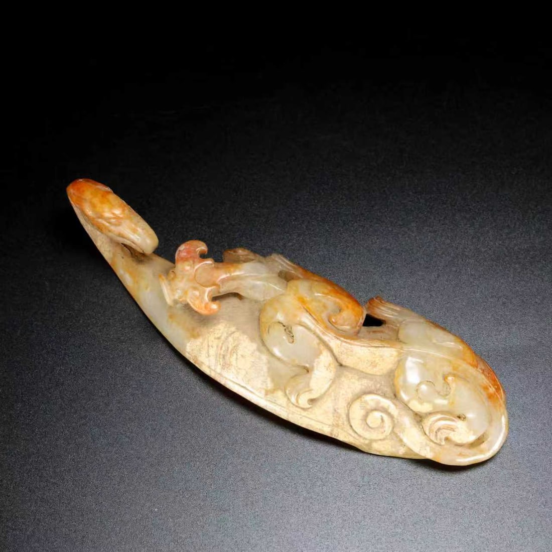 A Exquisite Hotan Jade Dragon Handheld Carving: An Exquisite Hotan Jade Dragon Handheld Carving,Han Dynasty, China,Size:4.7inx1.6inx1.2in,Weight:80.7g 和田玉龙手把件,中国汉代