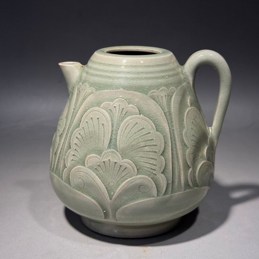 A Exquisite Yaozhou Kiln Moon White Glazed Flower Pattern Teapot: A Exquisite Yaozhou Kiln Moon White Glazed Flower Pattern Teapot,Song Dynasty, China,Size:4.5inx4.1in 耀州窑月白釉花卉纹壶,中国&