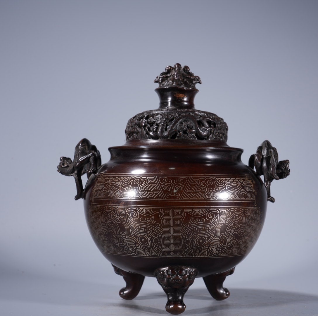 A Exquisite Silver-Inlaid Bronze Dragon-Ears Tripod Censer: An Exquisite Silver-Inlaid Bronze Dragon-Ears Tripod Censer,Ming Dynasty, China,With Mark,Size:7.9inx4.5in ,Weight:3635g 紫铜错银龙耳三足炉,ߑ