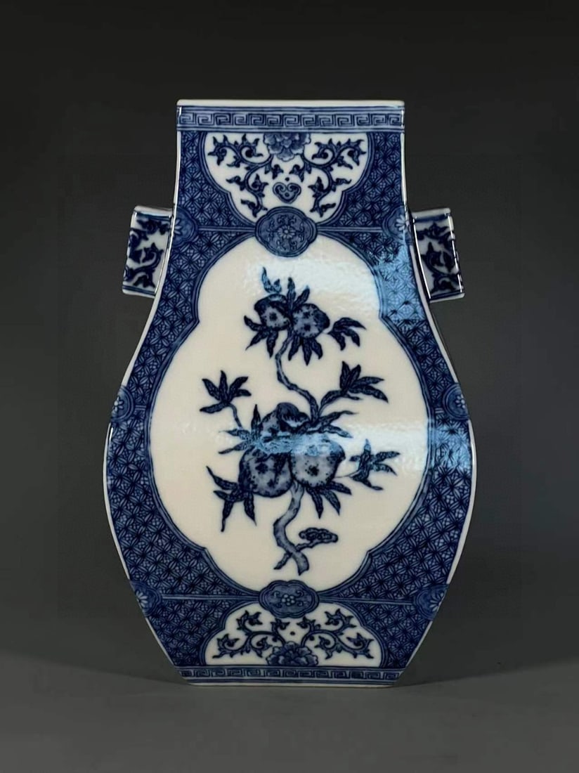 A Exquisite Blue and White Flower and Fruit Pattern Pierced Ears Vase: An Exquisite Blue and White Flower and Fruit Pattern Pierced Ears Vase,Qing Dynasty, China,Qianlong Six-character Mark,Size:12.7inx4.8inx4.5in 青花花果纹贯耳&