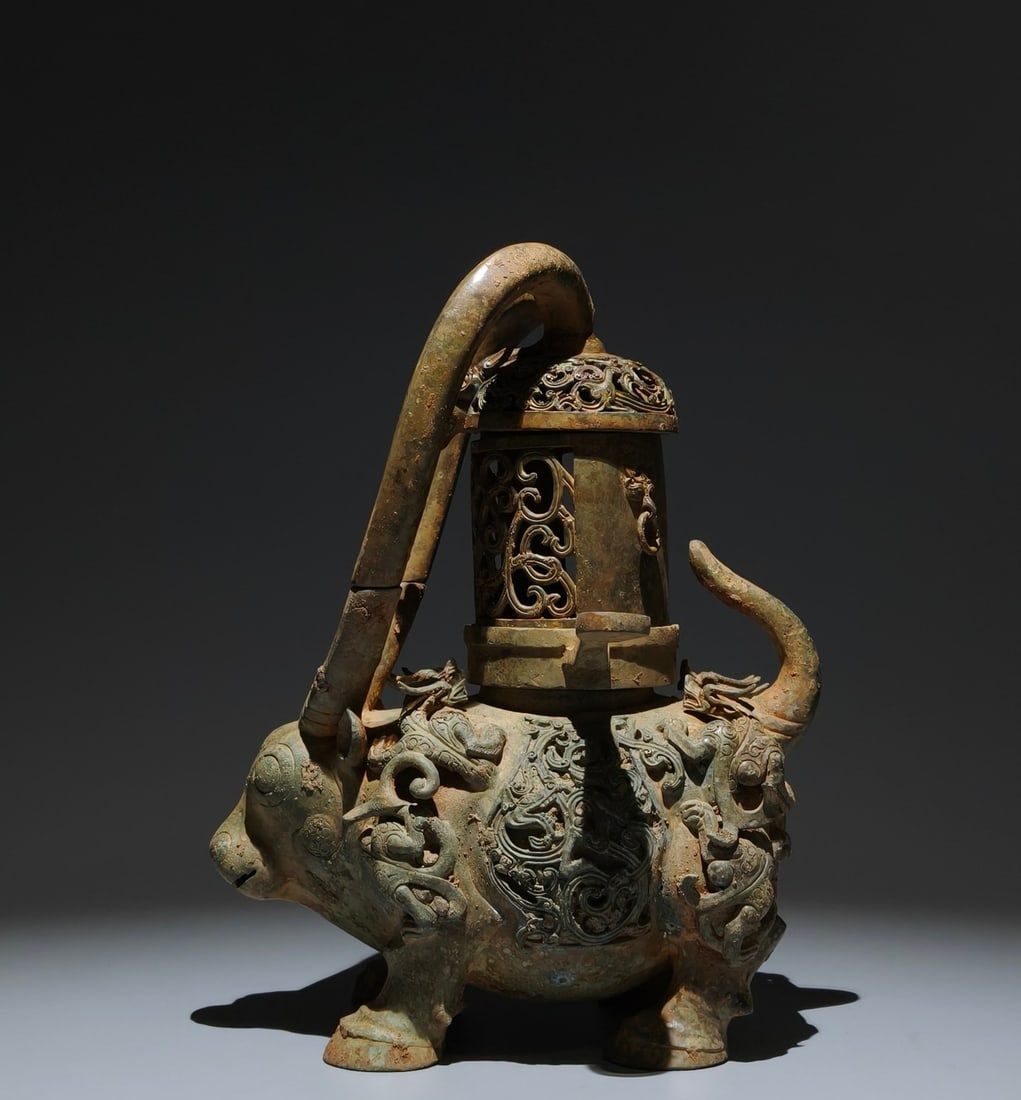 A Exquisite Bronze Dragon Pattern Auspicious Beast Candlestick: An Exquisite Bronze Dragon Pattern Auspicious Beast Candlestick,Han Dynasty, China,Size:11.8inx9.1inx5.5in 青铜龙纹瑞兽灯,中国汉代