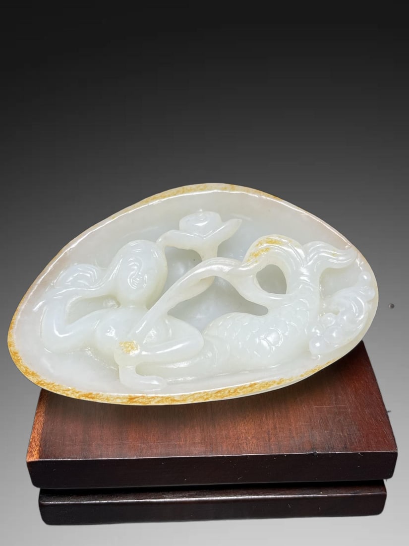 A Exquisite Hotan Jade Mermaid Handheld Carving: An Exquisite Hotan Jade Mermaid Handheld Carving,Qing Dynasty, China,Size:3.3inx1.2inx2.3in,Weight:119g