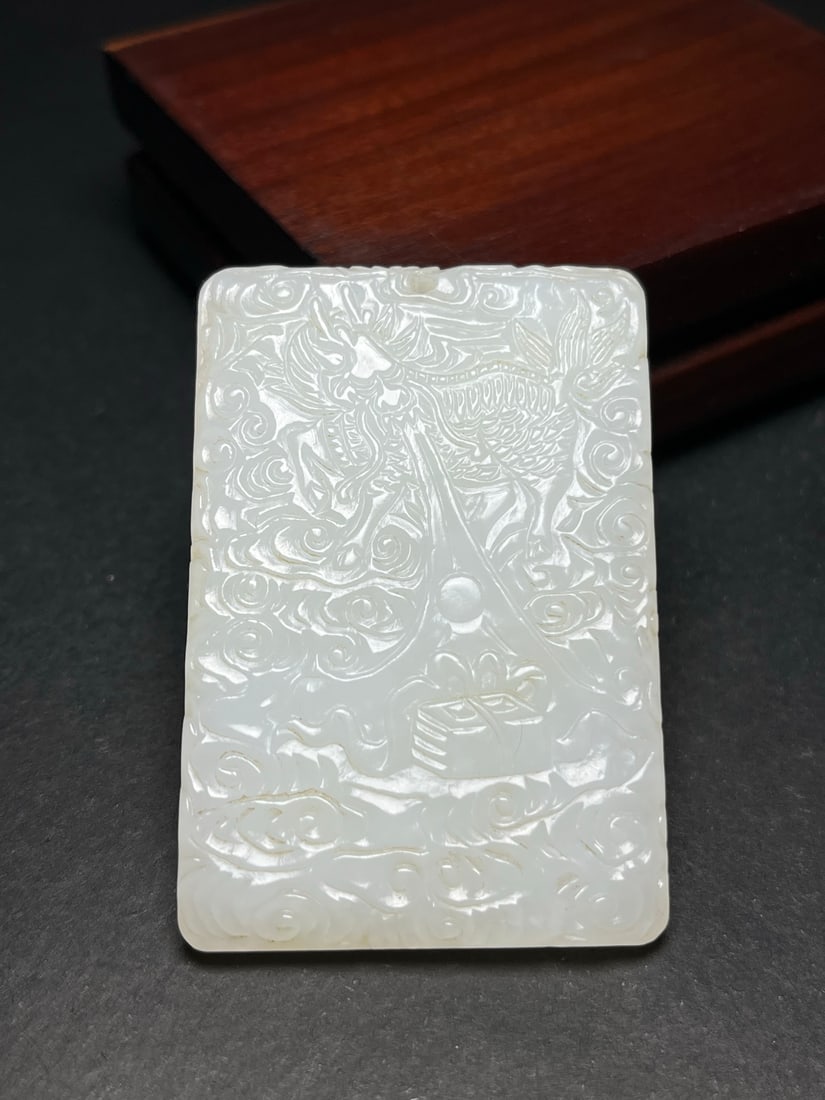 A Exquisite Hotan Jade Kylin Pattern pendant: A Exquisite Hotan Jade Kylin Pattern pendant,Qing Dynasty, China,Size:1.6inx0.2inx2.4in,Weight:41g 和田玉麒麟纹玉佩,中国清代