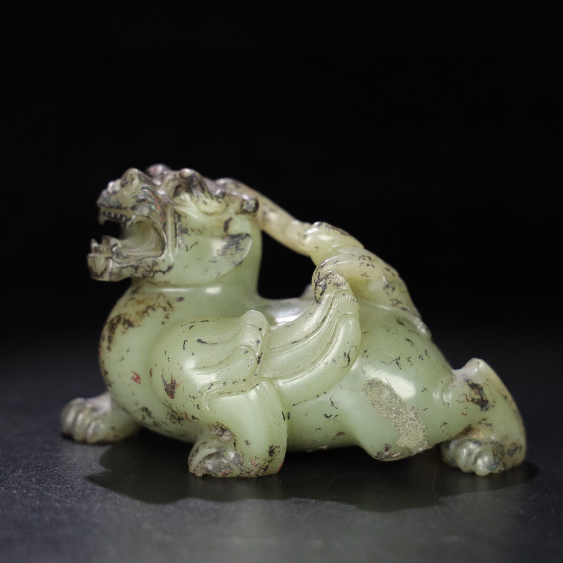 A Exquisite Hotan Jade Auspicious Beast Ornament: A Exquisite Hotan Jade Auspicious Beast Ornament,Qing Dynasty, China,Size:4.9inx2.8inx3in,Weight:615g 和田玉瑞兽摆件,中国清代