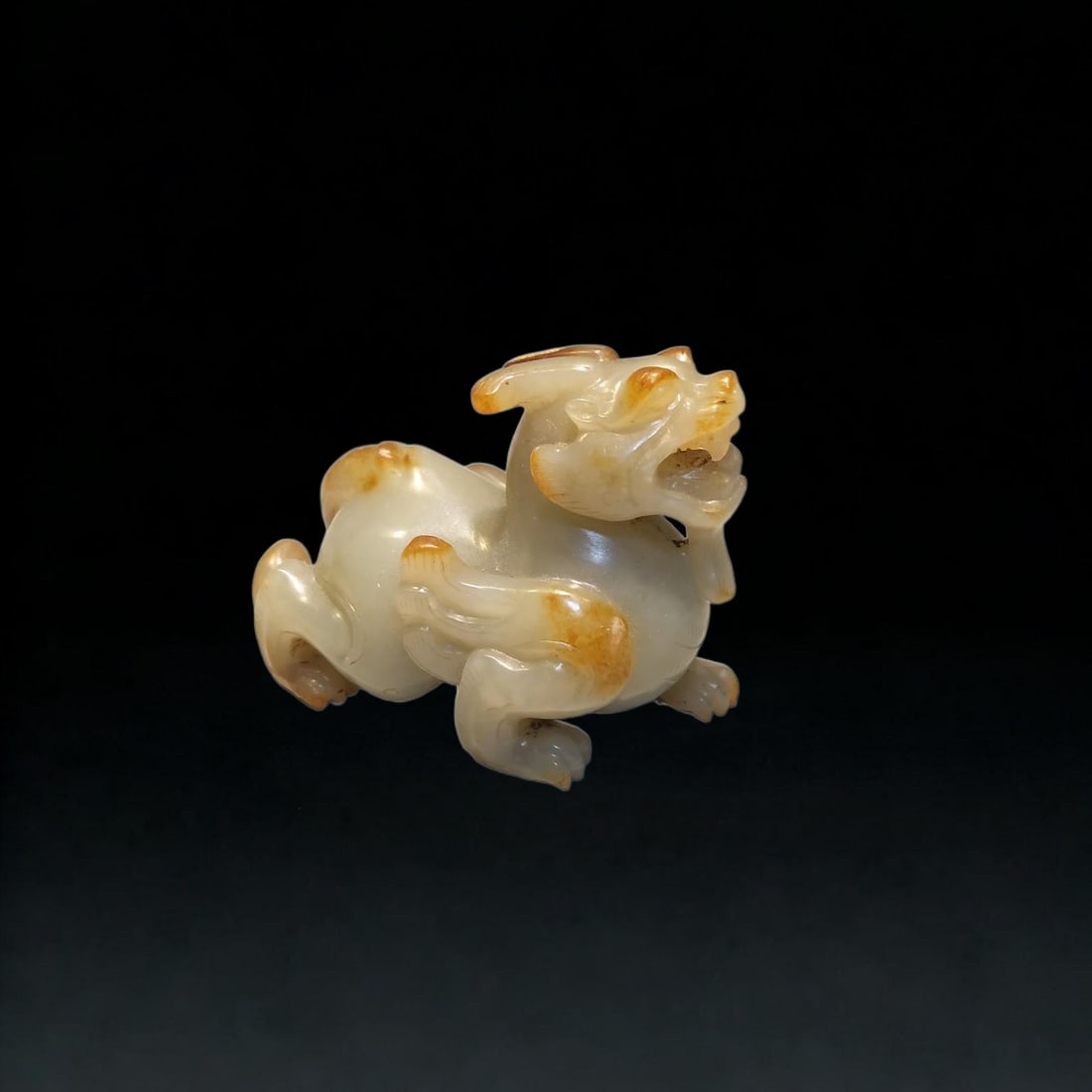 A Exquisite Hotan Jade Auspicious Beast Ornament: A Exquisite Hotan Jade Auspicious Beast Ornament,Han Dynasty, China,Size:2inx1.5inx2.6in,Weight:128g 和田玉瑞兽摆件,中国汉代