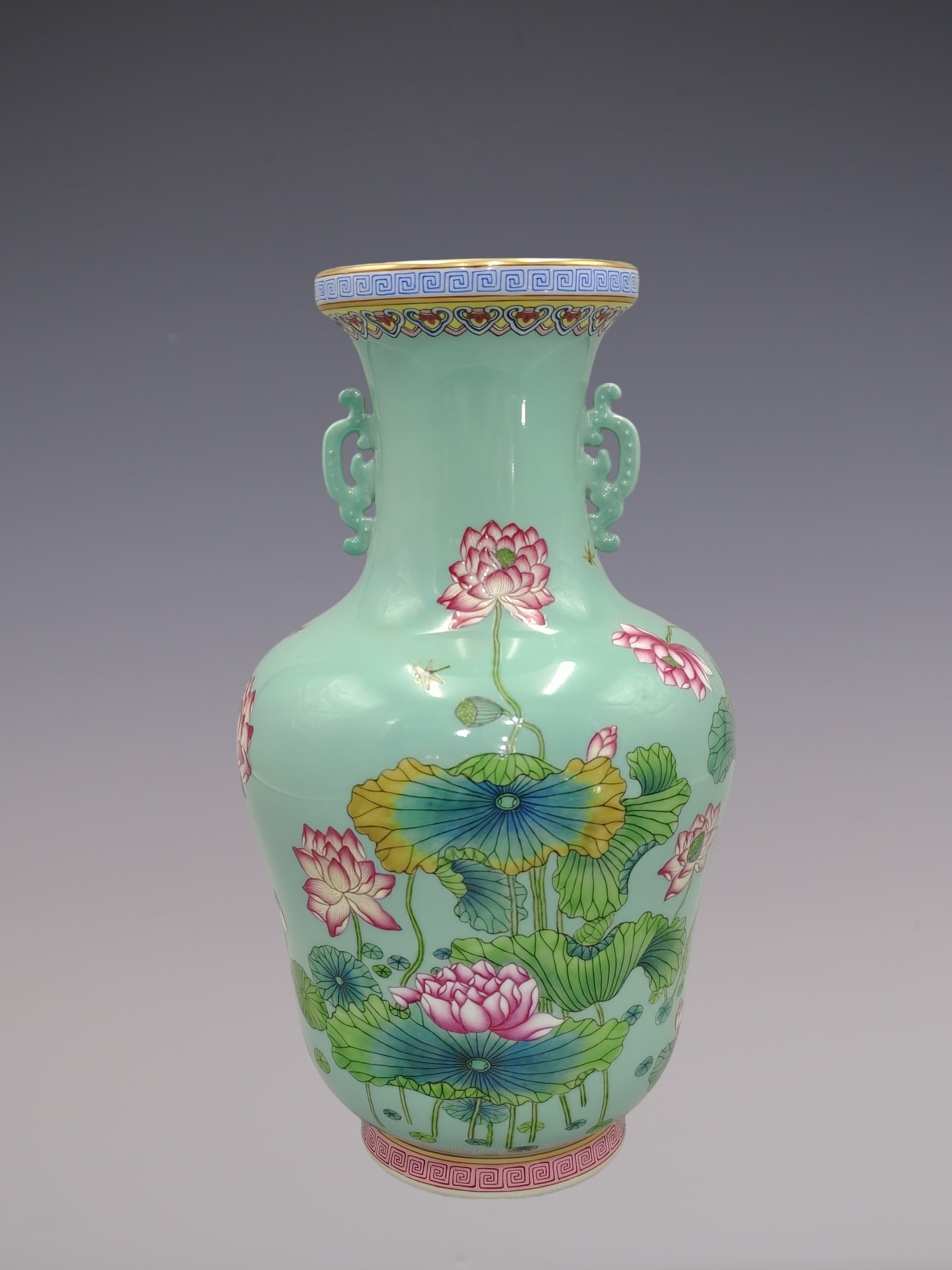 An Exquisite Famille-Rose Flower Pattern Double-Ears Vase: An Exquisite Famille-Rose Flower Pattern Double-Ears Vase Qing Dynasty, China Qianlong Six-character Mark Size:13inx7.9in粉彩花卉纹双耳瓶 中ࢲ