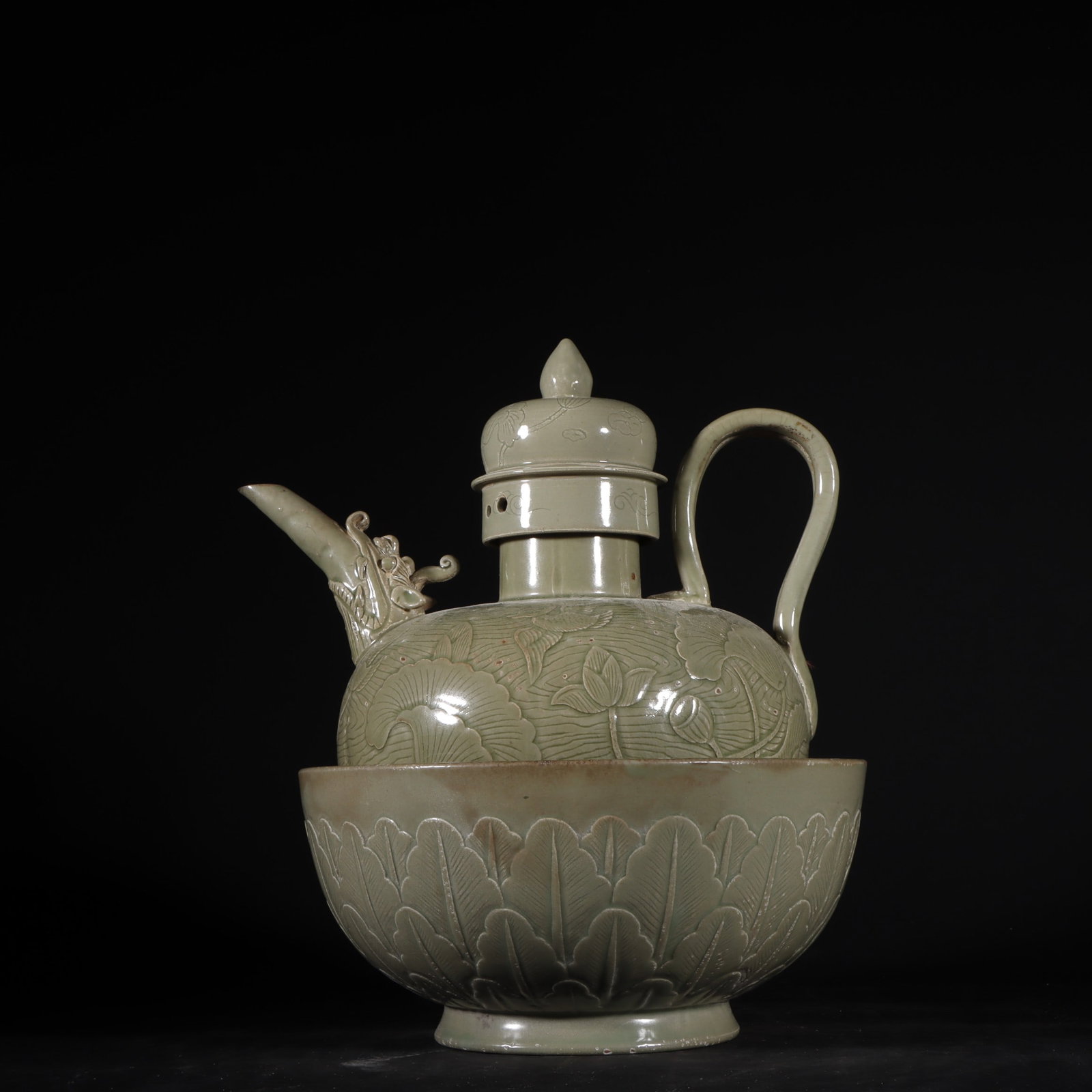 An Exquisite Yue yao Celadon Flower Pattern Ewer: An Exquisite Yue yao Celadon Flower Pattern Ewer Tang Dynasty, China Size:9.1inx8.7in越窑秘色青磁高浮雕荷花纹套壶 &#