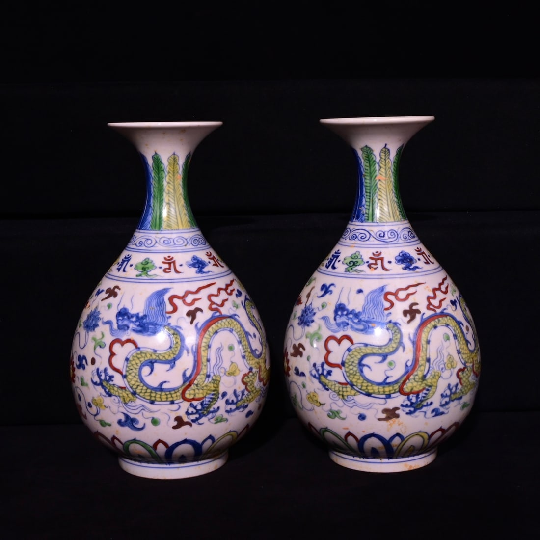 A Pair of Exquisite Doucai Dragon Pattern Lotus Pattern Vases,: A Pair of Exquisite Doucai Dragon Pattern Lotus Pattern Vases,Ming Dynasty, China,Chenghua Six-character Mark,Size:9.1inx5.1in