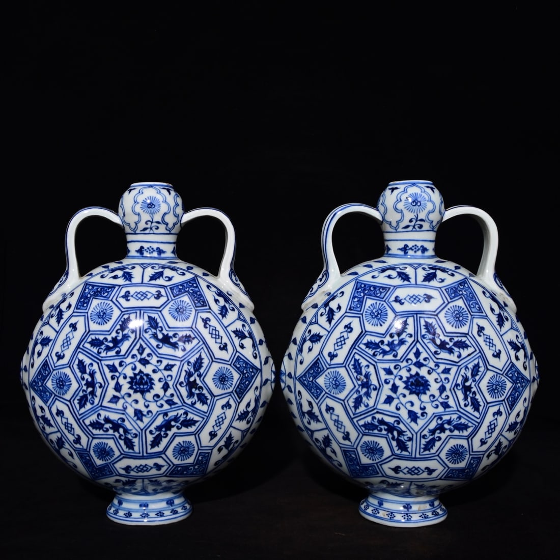 A Pair of Exquisite Blue and White Flower Pattern Double-Ears Vases,: A Pair of Exquisite Blue and White Flower Pattern Double-Ears Vases,Ming Dynasty, China,Yongle Four-character Mark,Size:11.8inx9.4in 一对青花花卉纹双