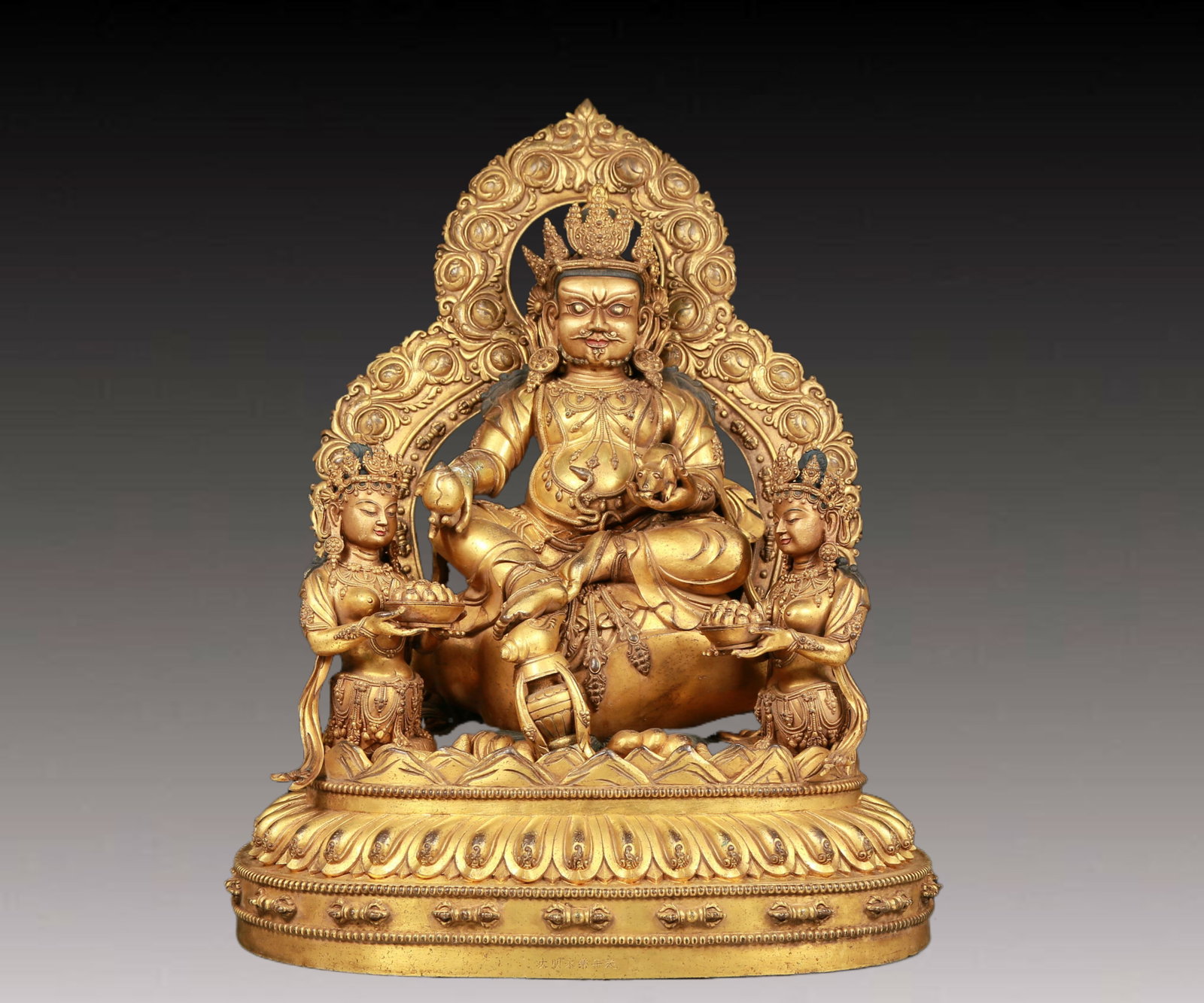 A solemn gilt bronze statue of Mammon: A solemn gilt bronze statue of Mammon,Yongle six-character mark,Ming Dynasty,China. This is a breathtaking piece of Buddhist art. The face of the Buddha statue is A solemn and kind,and its eyes are de