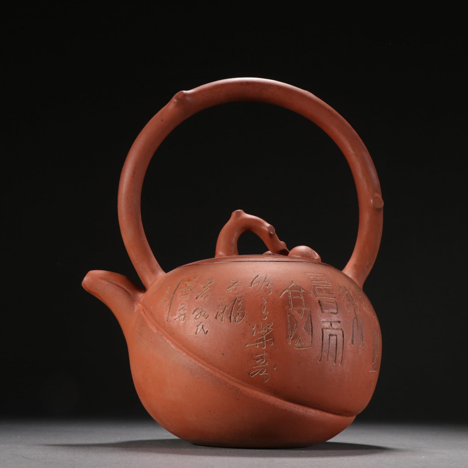 An Exquisite Purple Sands Peach Pattern Ewer,with poem: An Exquisite Purple Sands Peach Pattern Ewer,with poem,the Republic of China,with Famous Artisan Mark,Size:8.7inx7.1in,紫砂桃子纹提壶,带诗文