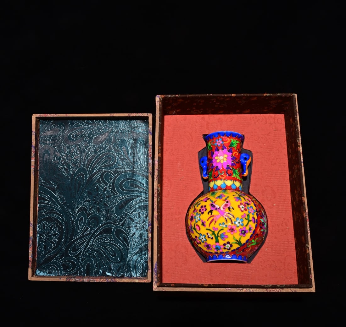 An Exquisite Enamel Flower and Bird Pattern Double-Ears Vase,: An Exquisite Enamel Flower and Bird Pattern Double-Ears Vase,Qing Dynasty, China,Qianlong Six-character Mark,Size:9.1inx5.5in 珐琅彩花鸟纹双耳瓶