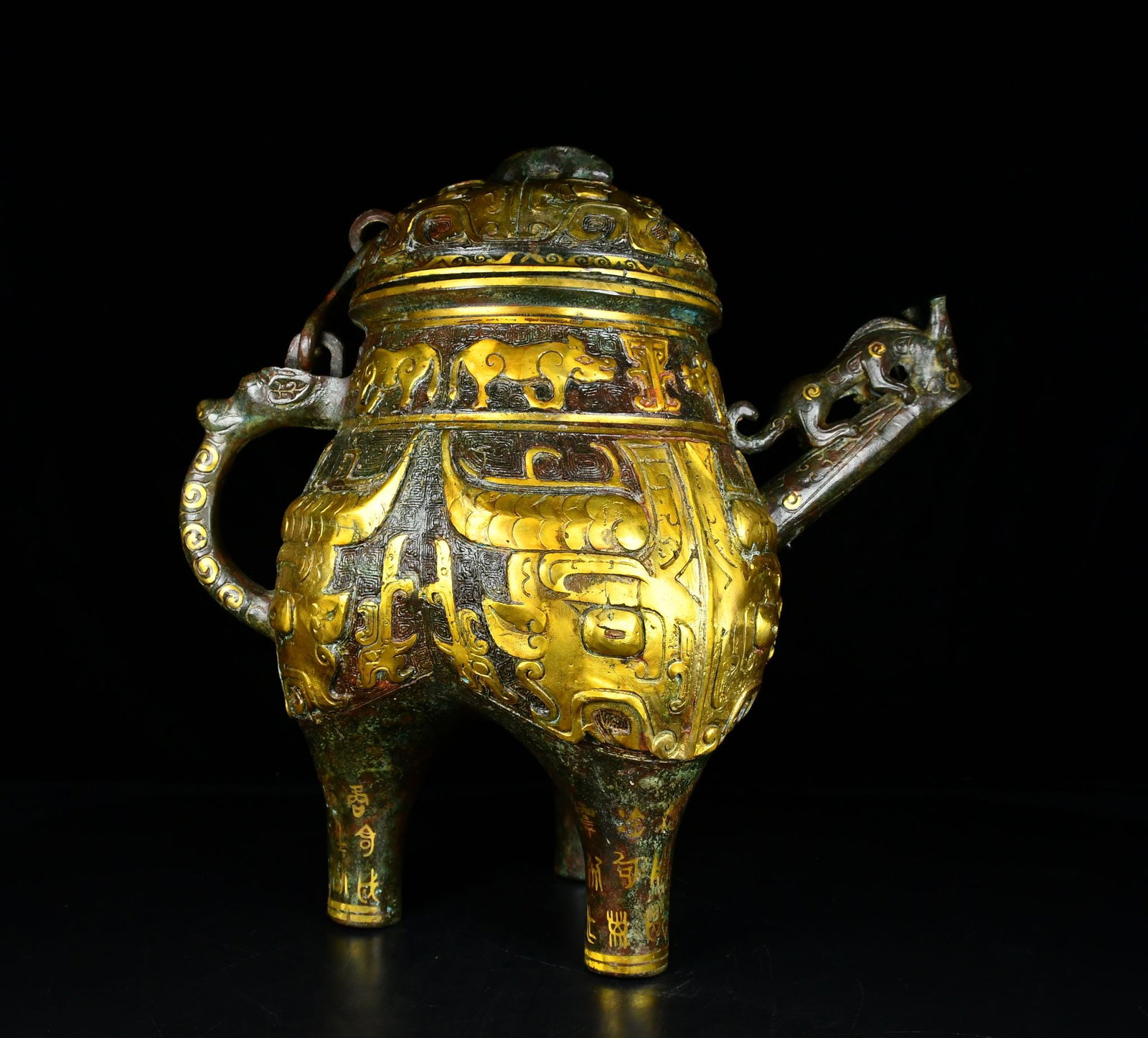An Exquisite Bronze Gold-Inlaid Beast-Face Pattern Ewer,With Inscription: An Exquisite Bronze Gold-Inlaid Beast-Face Pattern Ewer,With Inscription,the Warring States period in