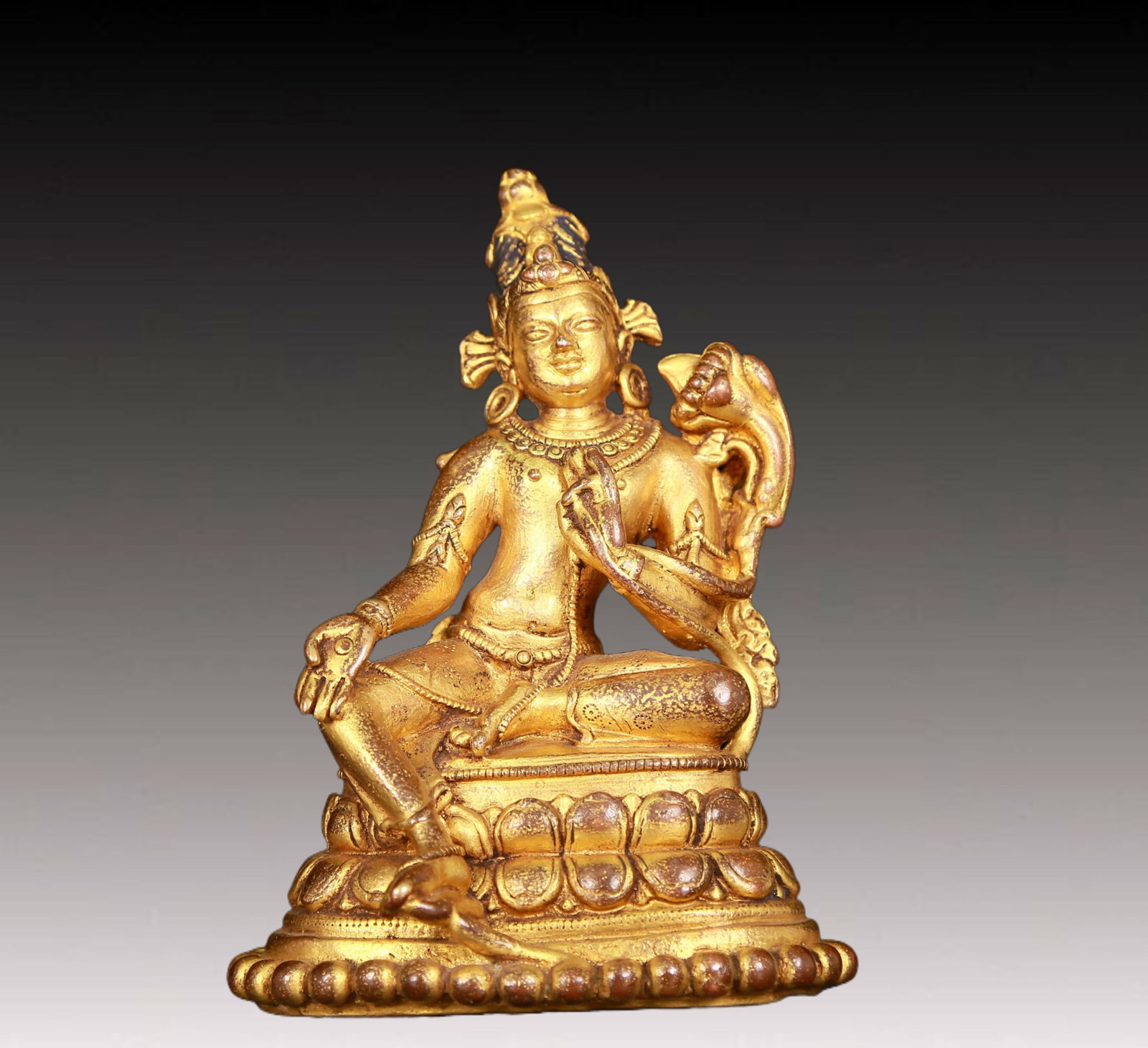 An exquisite gilt bronze statue of green Tara: An exquisite gilt-bronze green Tara statue,Ming Dynasty,China. Tara has an elegant posture with a peaceful and compassionate expression. Her face is soft and solemn,and her eyes are warm. She seems to