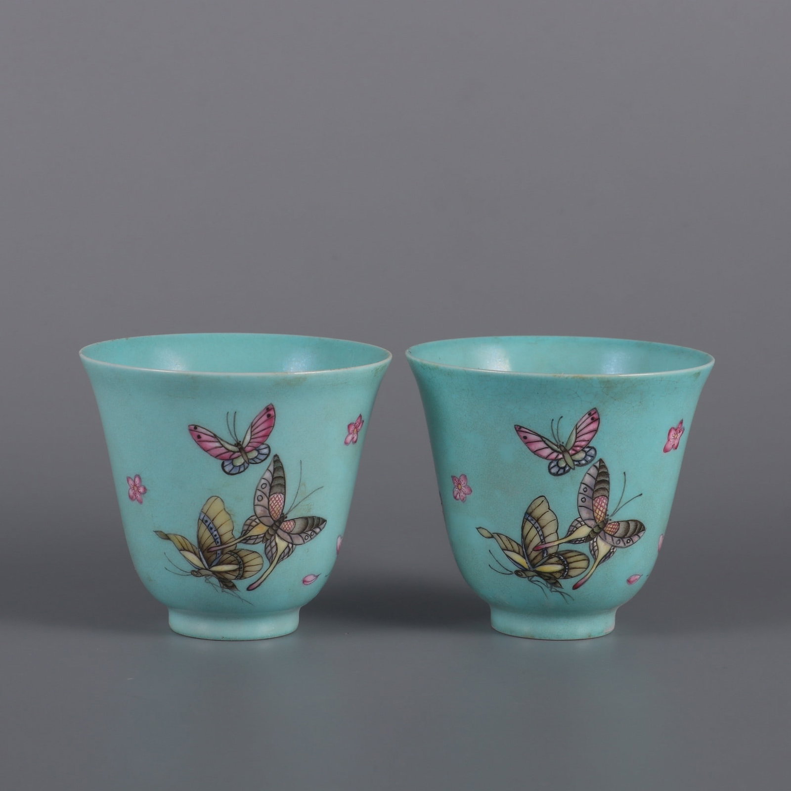 A Pair of Exquisite Enamel Green Ground Flower and Butterfly Pattern Cups (1 of 9)
