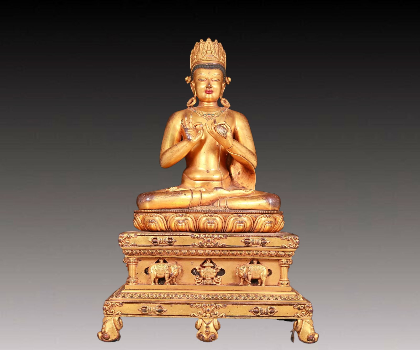 A solemn gilt bronze statue of Bodhisattva: A solemn gilt bronze statue of the Bodhisattva,Qianlong mark,with inscription,Qing Dynasty,China. The Bodhisattva's posture is graceful and serene,his face is A solemn and kind,and his eyes are