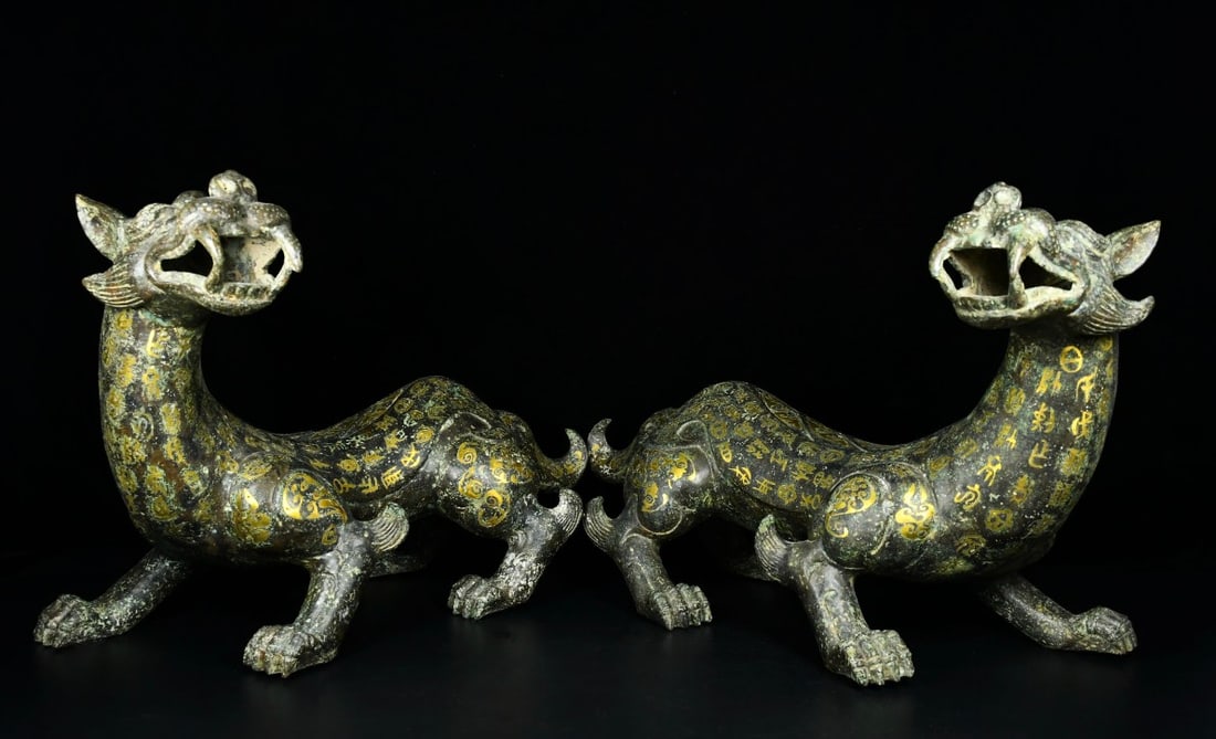 A Pair of Exquisite Bronze Gold-Inlaid Auspicious Animal Ornament,With Inscriptions: A Pair of Exquisite Bronze Gold-Inlaid Auspicious Animal Ornament,With Inscriptions,the Warring States period in China,Size:13.4inx23.6in,Weight:12800g,一对青铜错金