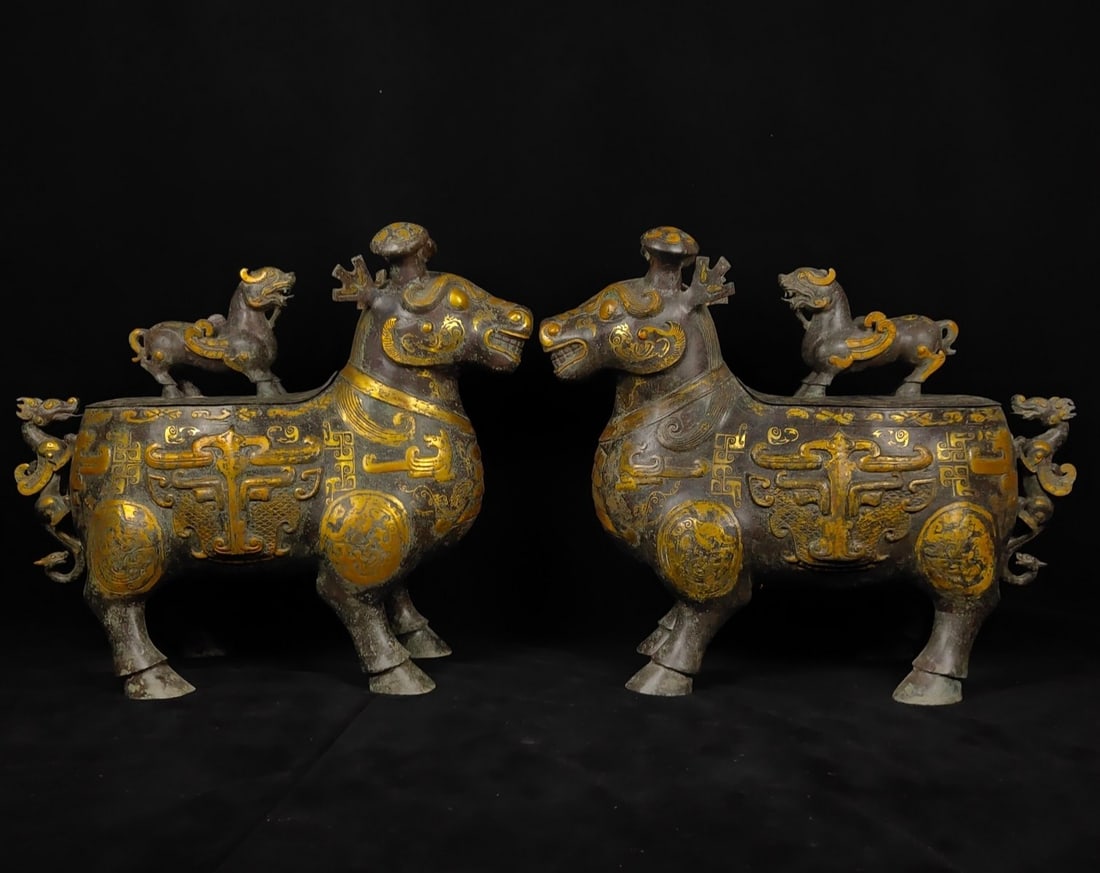 A Pair of Exquisite Bronze Gold-Inlaid Auspicious Animal Ornament,With Inscriptions: A Pair of Exquisite Bronze Gold-Inlaid Auspicious Animal Ornament,With Inscriptions,the Warring States period in China,Size:24inx28.3in,Weight:45000g,一对青铜错金&#