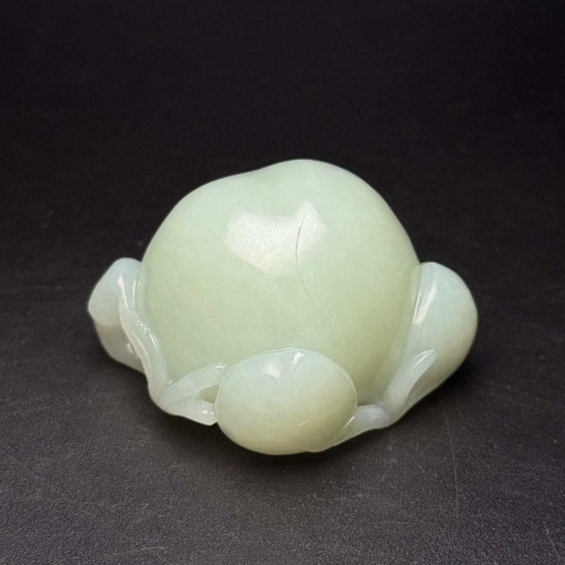 An Exquisite White Jade Peach Ornament: An Exquisite White Jade Peach Ornament,Qing Dynasty,China,Size:2.3inx1.8inx1.4in,Weight:106g,白玉桃子摆件,中国清代