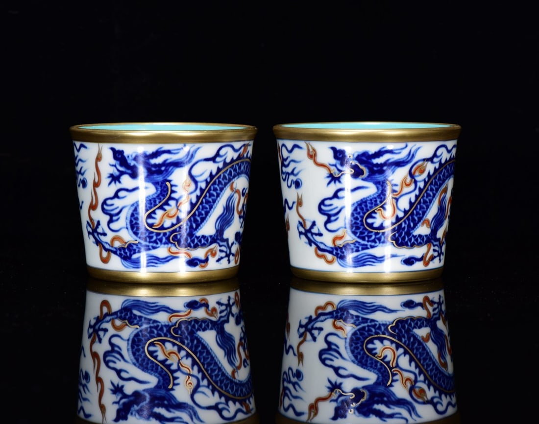 A Pair of Exquisite Blue and White Underglaze-Red Painted Gold Dragon Pattern Cups: A Pair of Exquisite Blue and White Underglaze-Red Painted Gold Dragon Pattern Cups,Qing Dynasty,China,with Yongzheng Four-character Mark,Size:2.6inx3.1in,一对青花釉ດ