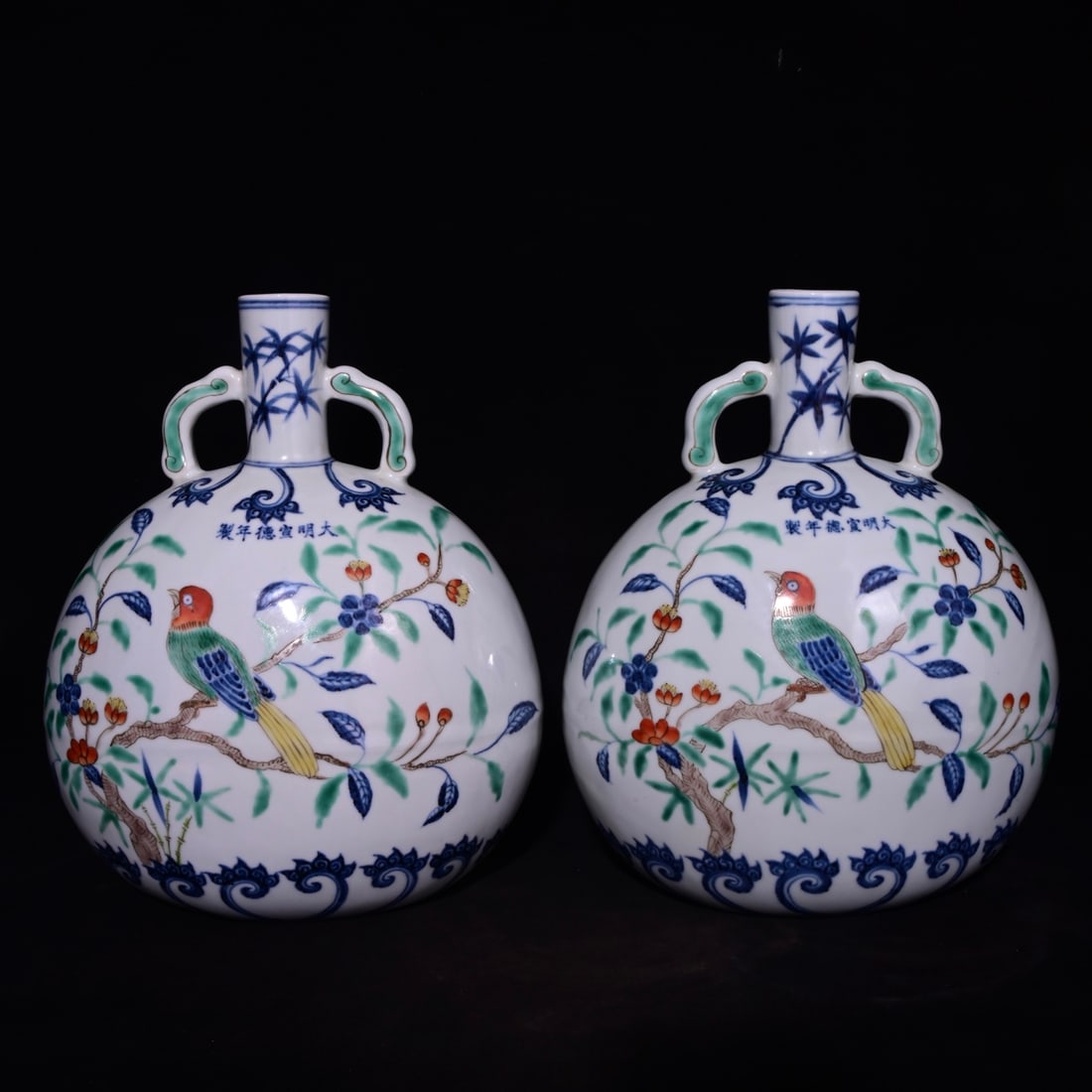A Pair of Exquisite Wucai Flower and Bird Pattern Double-Ears Vases,: A Pair of Exquisite Wucai Flower and Bird Pattern Double-Ears Vases,Ming Dynasty, China,Xuande Six-character Mark,Size:11.6inx9.4in