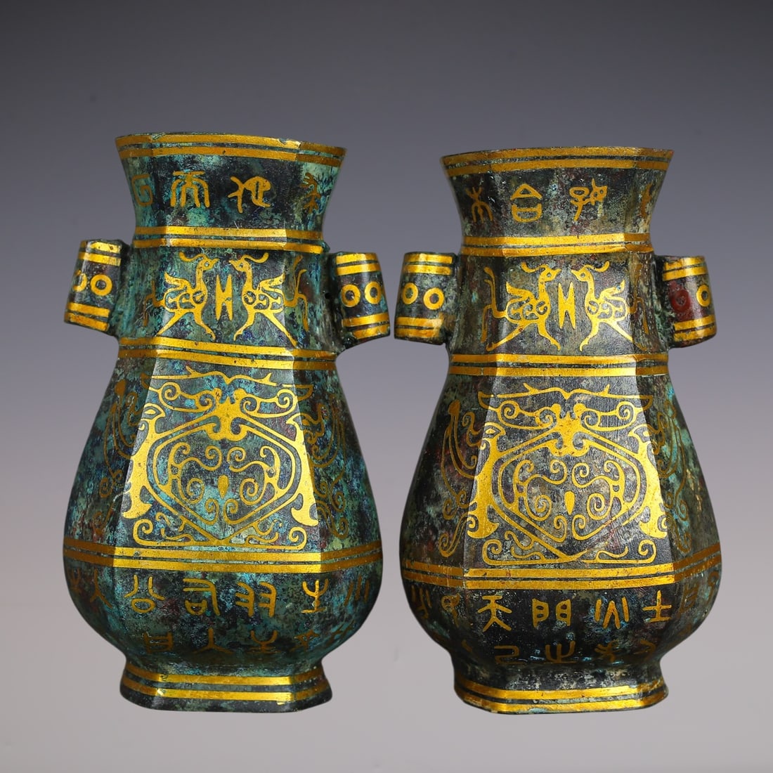 A Pair of Archaic Bronze Inlaid Gold Auspicious Beast Pattern Double-Ears Vases,With Inscription: A Pair of Archaic Bronze Inlaid Gold Auspicious Beast Pattern Double-Ears Vases,With Inscription,Han Dynasty,China,Size:4.3inx3.3inx7.1in,Total