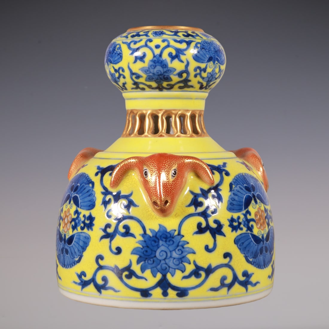 An Exquisite Blue and White Painted Gold Lotus Pattern Vase: An Exquisite Blue and White Painted Gold Lotus Pattern Vase Qing Dynasty, China Qianlong Six-character Mark Size:5.9inx4.9in青花黄地描金缠枝莲