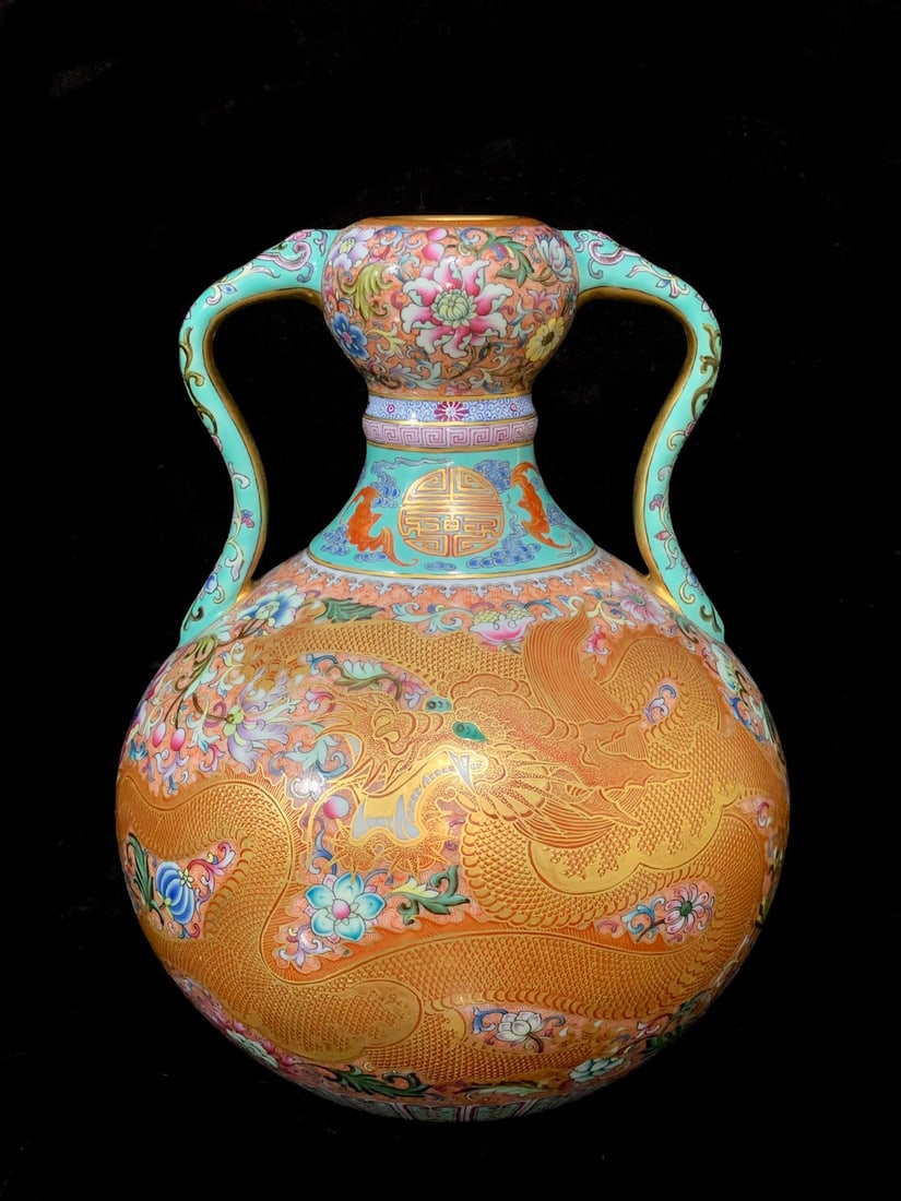 An Exquisite Turquoise Ground Famille-Rose Painted Gold Lotus and Dragon Pattern Double-Ears Vase: An Exquisite Turquoise Ground Famille-Rose Painted Gold Lotus and Dragon Pattern Double-Ears Vase,Qing Dynasty,China,Qianlong Six-character Mark,Size:8.3inx6.7inx3.7in松石绿地&