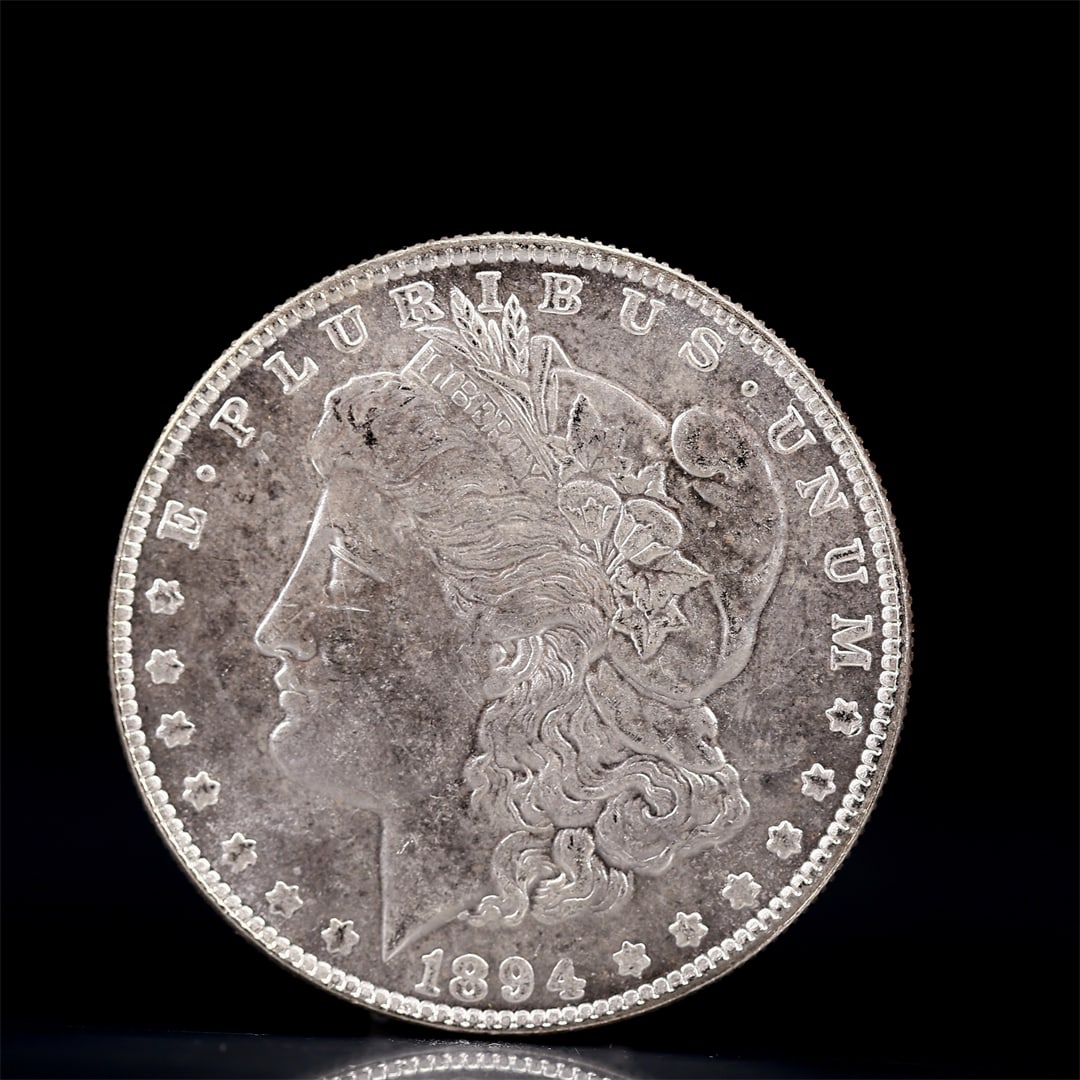 USA Morgan Dollar 1894 Coin: Obv: profile bust with date below and E PLURIBUS UNUM legend and stars around. Rev: eagle with In God we trust above within wreath with UNITED STATES OF AMERICA ONE DOLLAR legend. IN GOD WE TRUST / LI