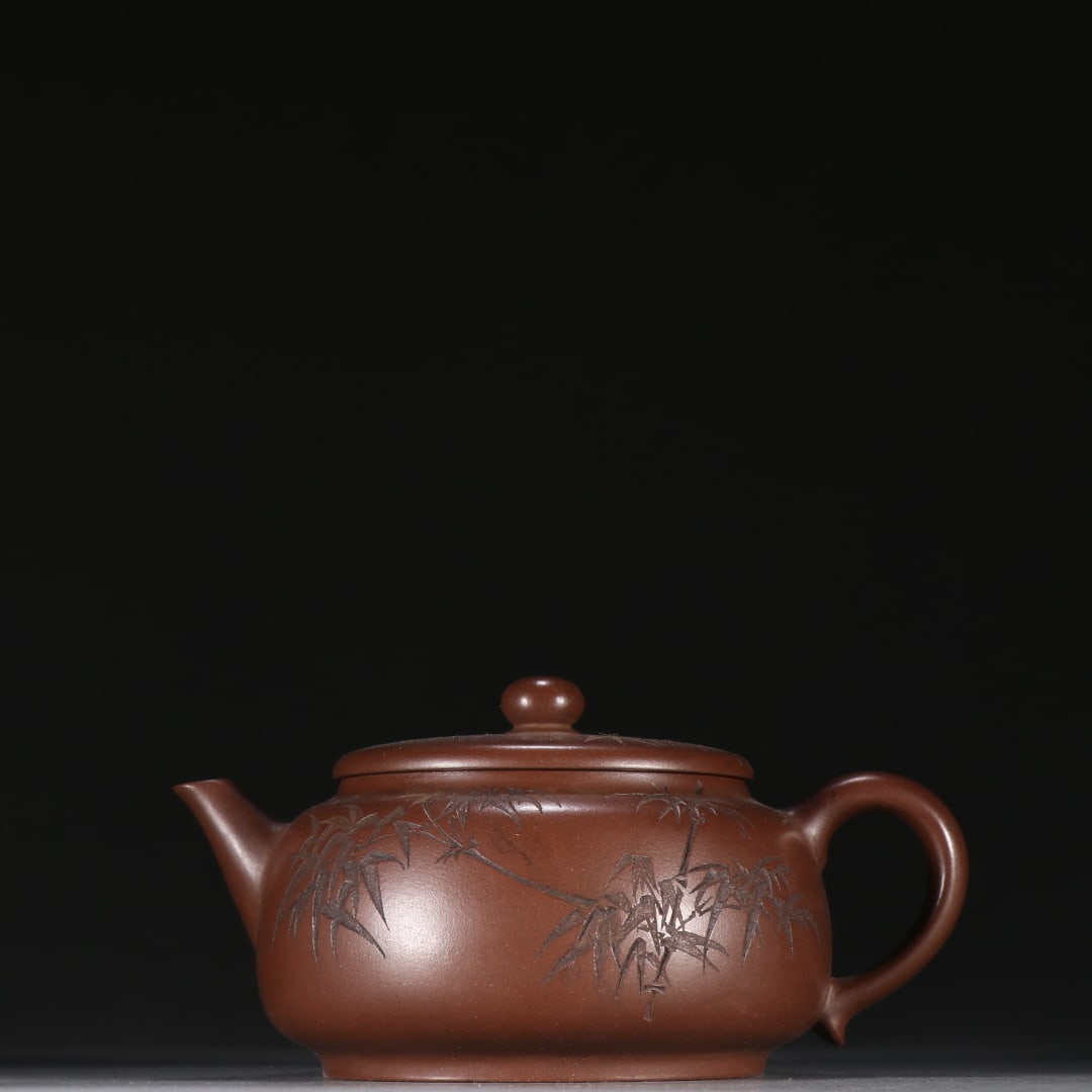 An Exquisite Purple Sands Bamboo Pattern with poem Teapot: An Exquisite Purple Sands Bamboo Pattern with poem Teapot Qing Dynasty, China Size:2.8inx5.2in紫砂刻竹纹诗文茶壶 中国清代 