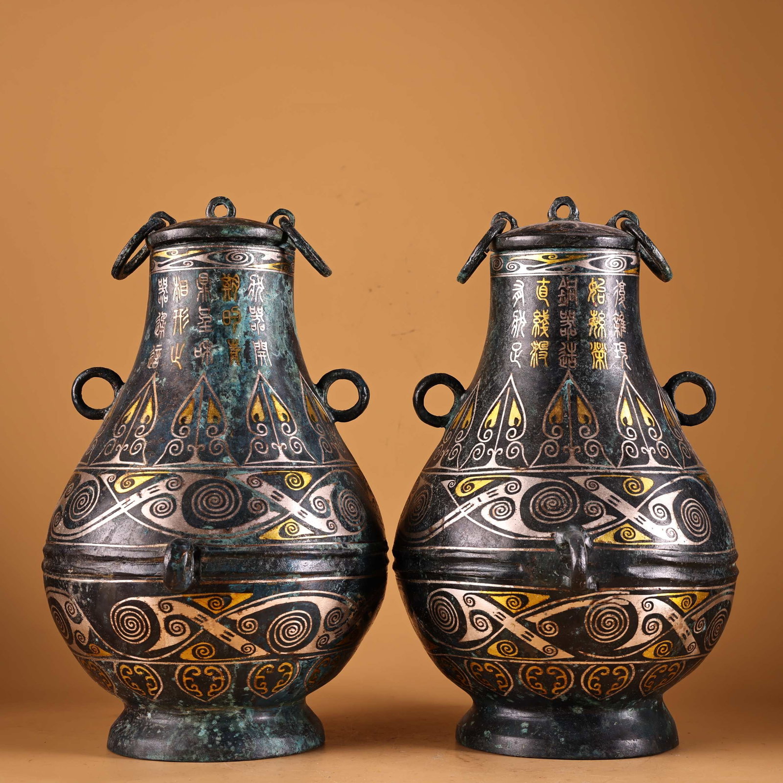 A Pair of Exquisite Bronze Inlaid Gold and Silver Double-Ears Vases,With Inscription: A Pair of Exquisite Bronze Inlaid Gold and Silver Double-Ears Vases,With Inscription,Qing Dynasty, China,Size:10.2inx7.5in,Total Weight:3200g一对青铜错金银