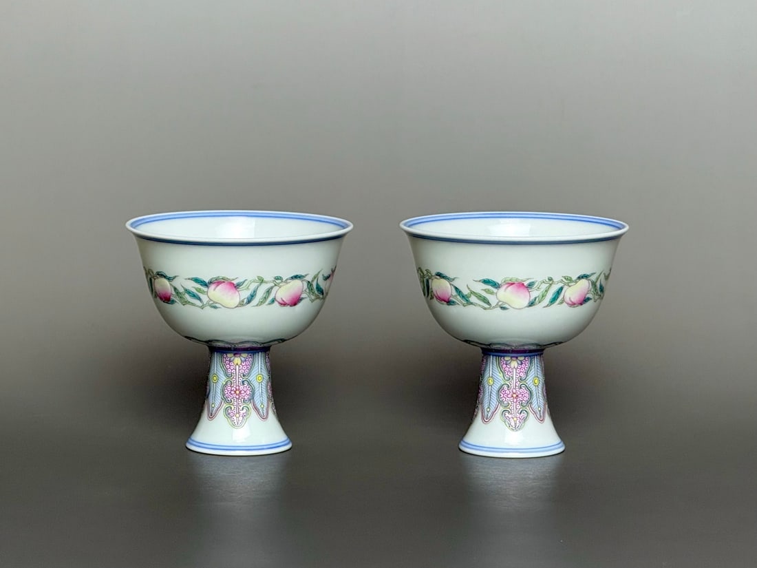 A Pair of Exquisite Famille-Rose Peach Pattern Stem Cups: A Pair of Exquisite Famille-Rose Peach Pattern Stem Cups,Qing Dynasty,China,Yongzheng Six-character Mark,Size:3.1inx3.1inx1.5in一对粉彩寿桃纹高足&