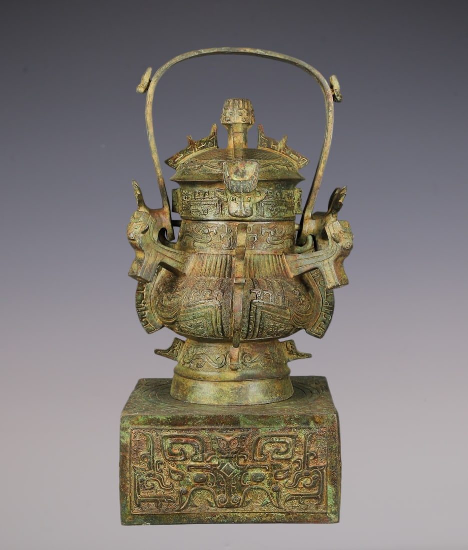 An Archaic Bronze Beast-Face Pattern Beast-Ears Loop-Handled Pot,With Inscription,With Base: An Archaic Bronze Beast-Face Pattern Beast-Ears Loop-Handled Pot,With Inscription,With Base,W.Zhou