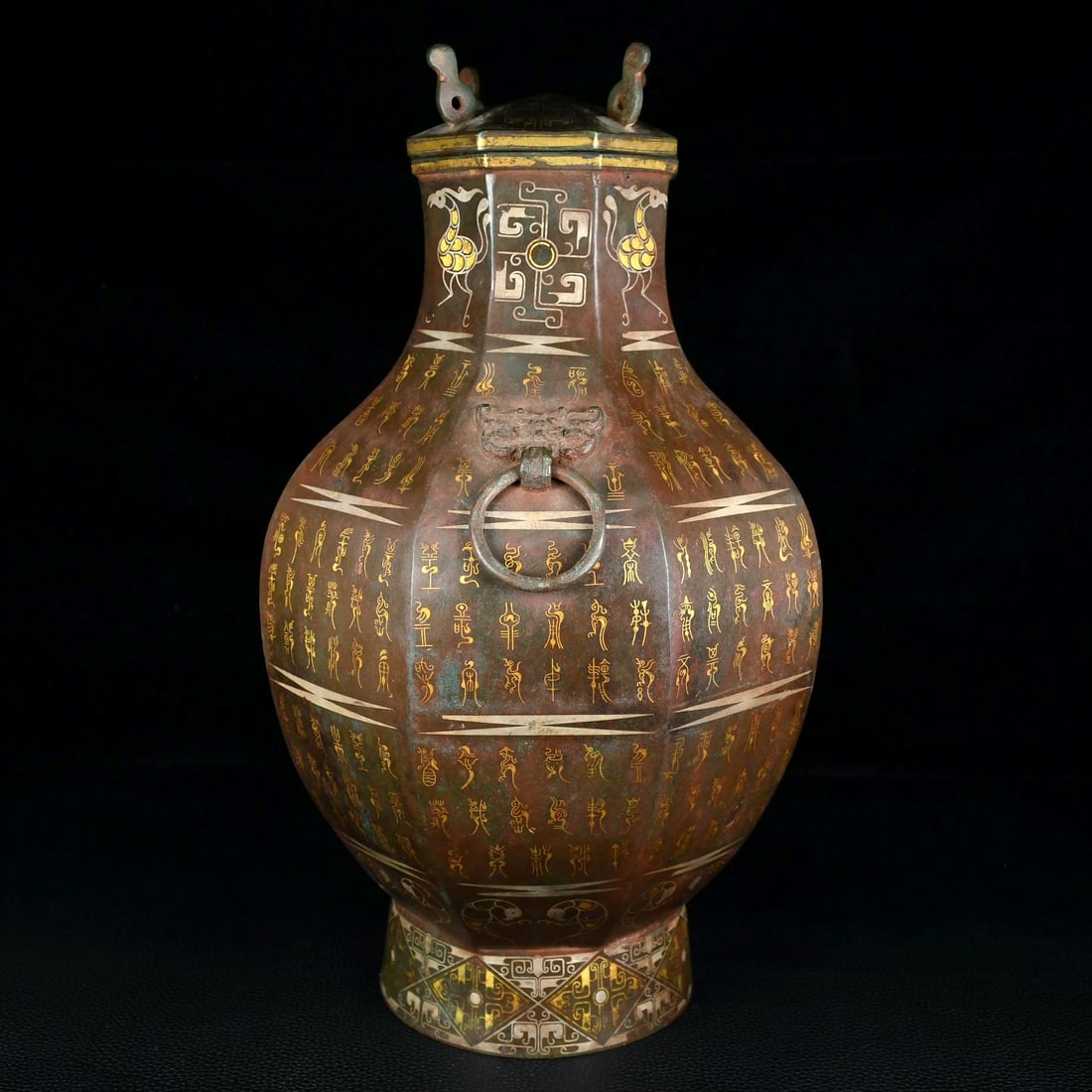 An Archaic Bronze Inlaid Gold and Silver Beast-Ears Pot,With Bird Seal Script: An Archaic Bronze Inlaid Gold and Silver Beast-Ears Pot,With Bird Seal Script,Qing Dynasty, China,Size:13.8inx7.9in,Weight:4400g青铜错金银兽耳壶,带