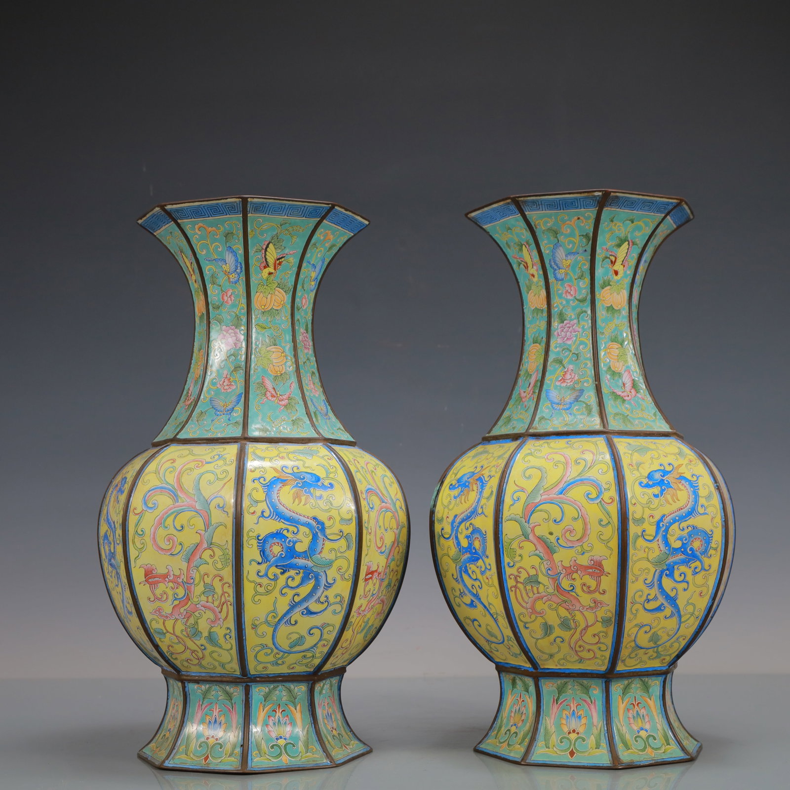 A Exquisite A pair of Coppery Enamel Flower and Butterfly Pattern Dragon Pattern Vase: A Exquisite A pair of Coppery Enamel Flower and Butterfly Pattern Dragon Pattern Vase Qing Dynasty, China Size:7.1inx13.4in Weight:4200g一对铜珐琅彩花卉