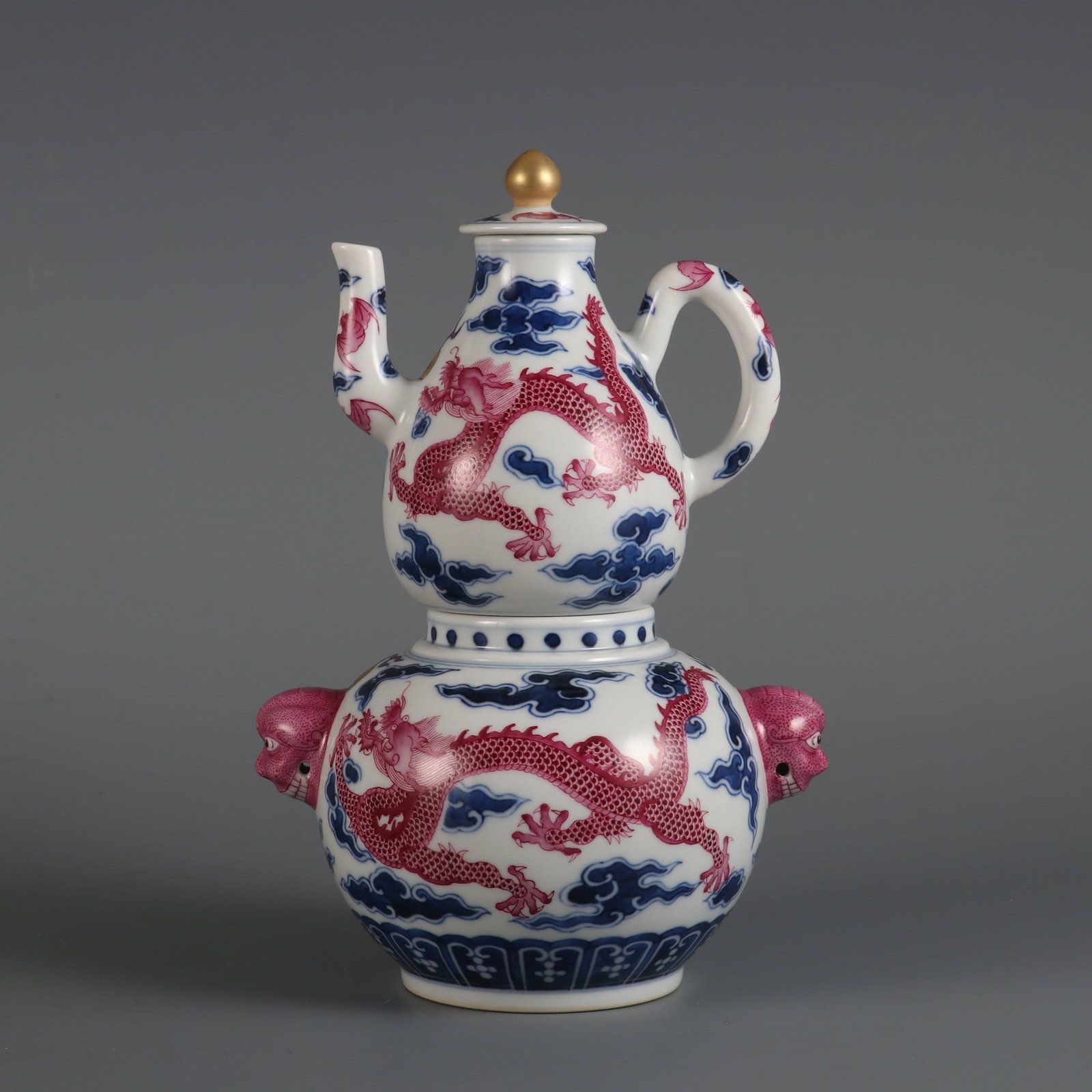 An Exquisite Blue and White Ruby Red-Glazed Dragon Pattern Ewer: An Exquisite Blue and White Ruby Red-Glazed Dragon Pattern Ewer Qing Dynasty, China Size:8.5inx5.3in青花胭脂红龙纹执壶 中国清