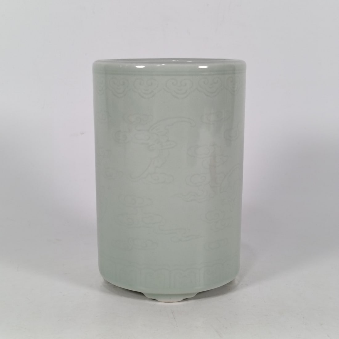 An Exquisite Celadon Glazed Auspicious Cloud and Bats Pattern Tripod Brush Pot (1 of 6)