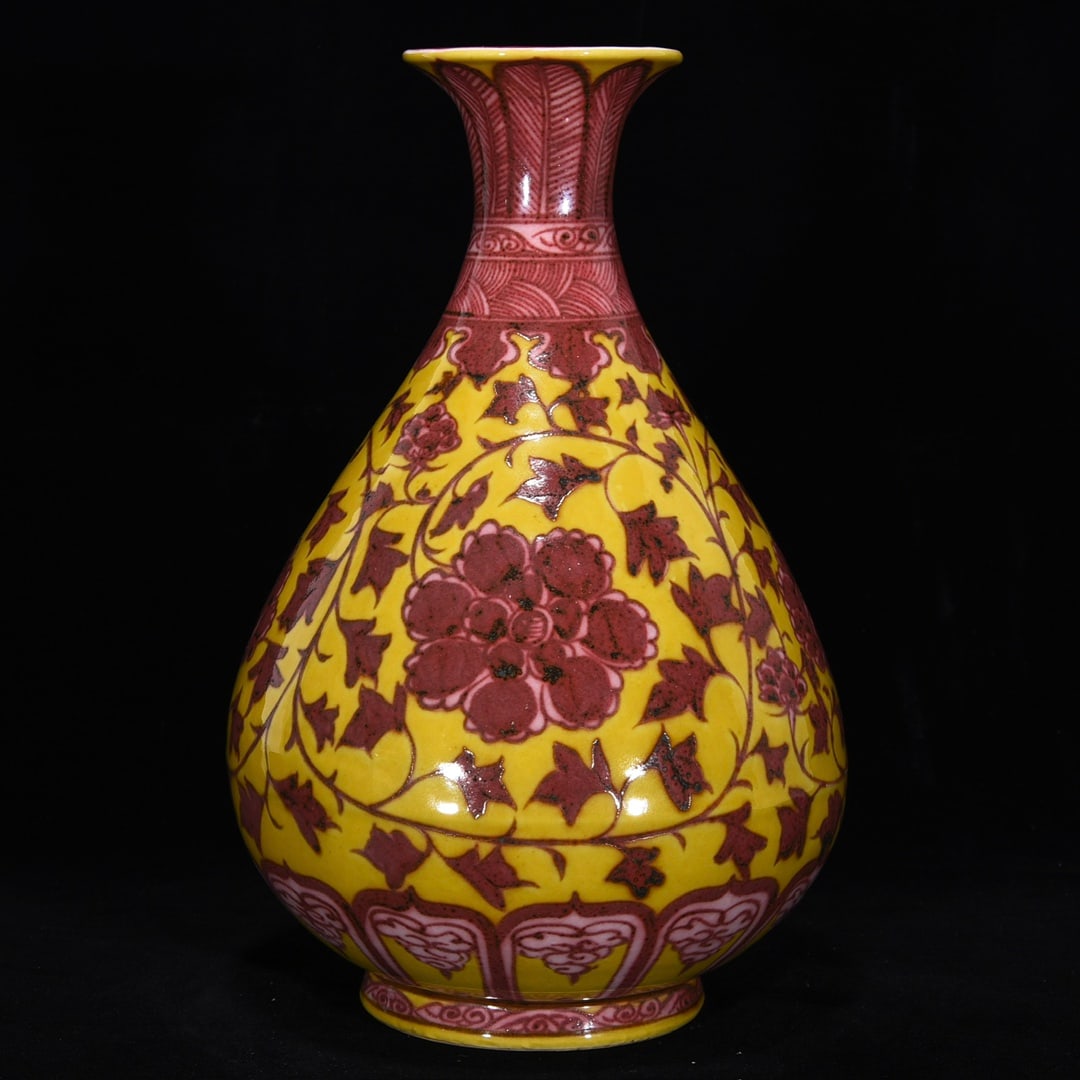 An Exquisite Underglaze-Red Lotus Pattern Vase: An Exquisite Underglaze-Red Lotus Pattern Vase Ming Dynasty, China Size:12.2inx7.7in黄地釉里红缠枝花卉玉壶春瓶 中