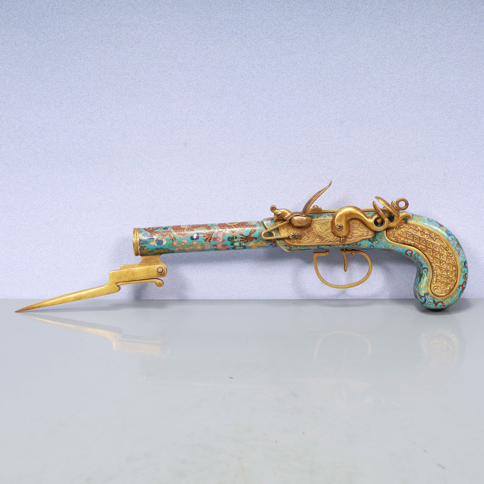 A Exquisite Cloisonne Dragon Pattern Pistol: A Exquisite Cloisonne Dragon Pattern Pistol Qing Dynasty, China Qianlong Four-character Mark Size:15inx3.1inx1.2in Weight:650g景泰蓝龙纹手枪 中国&
