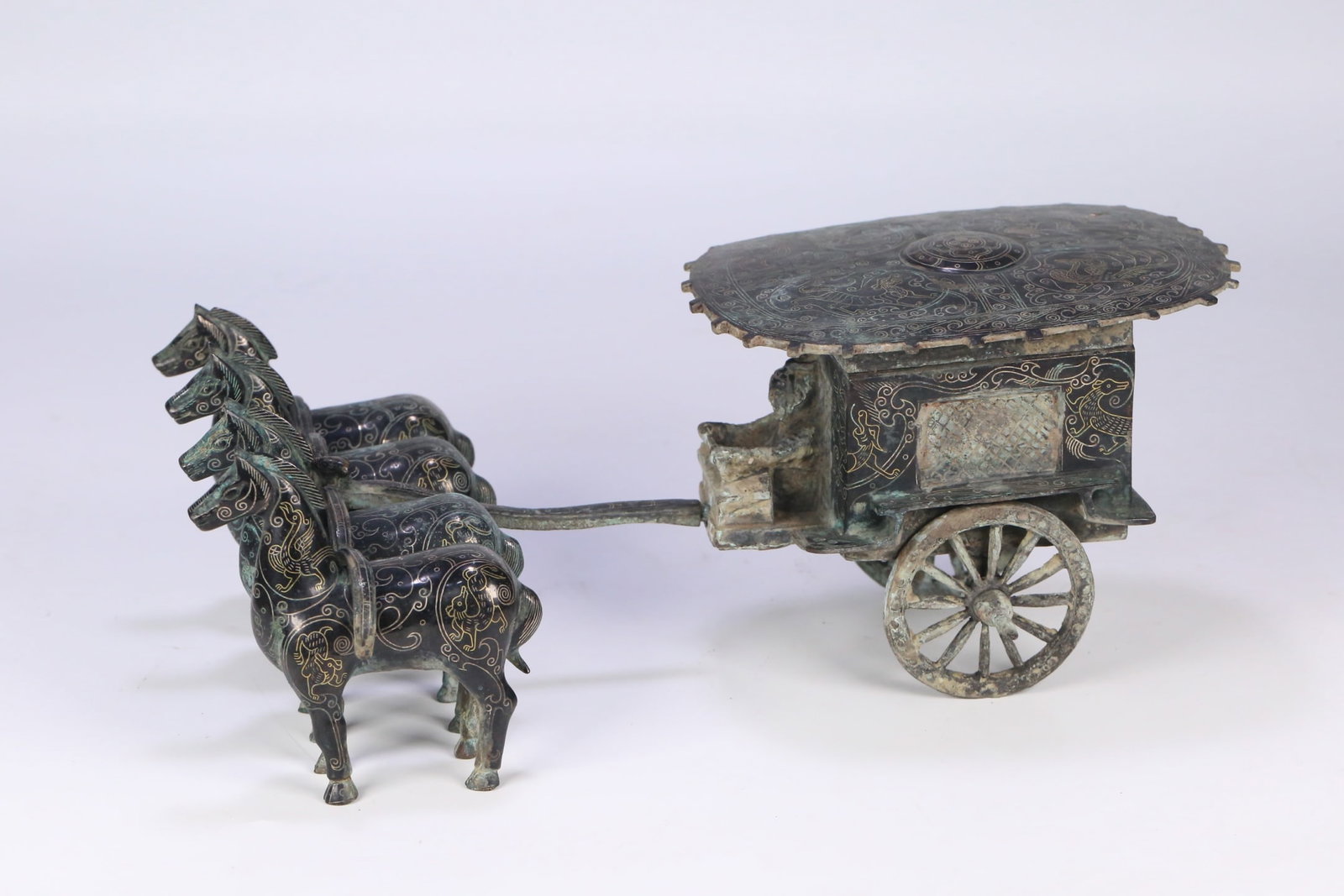 An Exquisite Bronze Inlaid Gold and Silver Auspicious Beast Pattern Horse-drawn Carriage Ornament: An Exquisite Bronze Inlaid Gold and Silver Auspicious Beast Pattern Horse-drawn Carriage Ornament,Han Dynasty, ChinaSize:13inx6.9inx5.1in,Weight:2810g铜错金银瑞兽&#